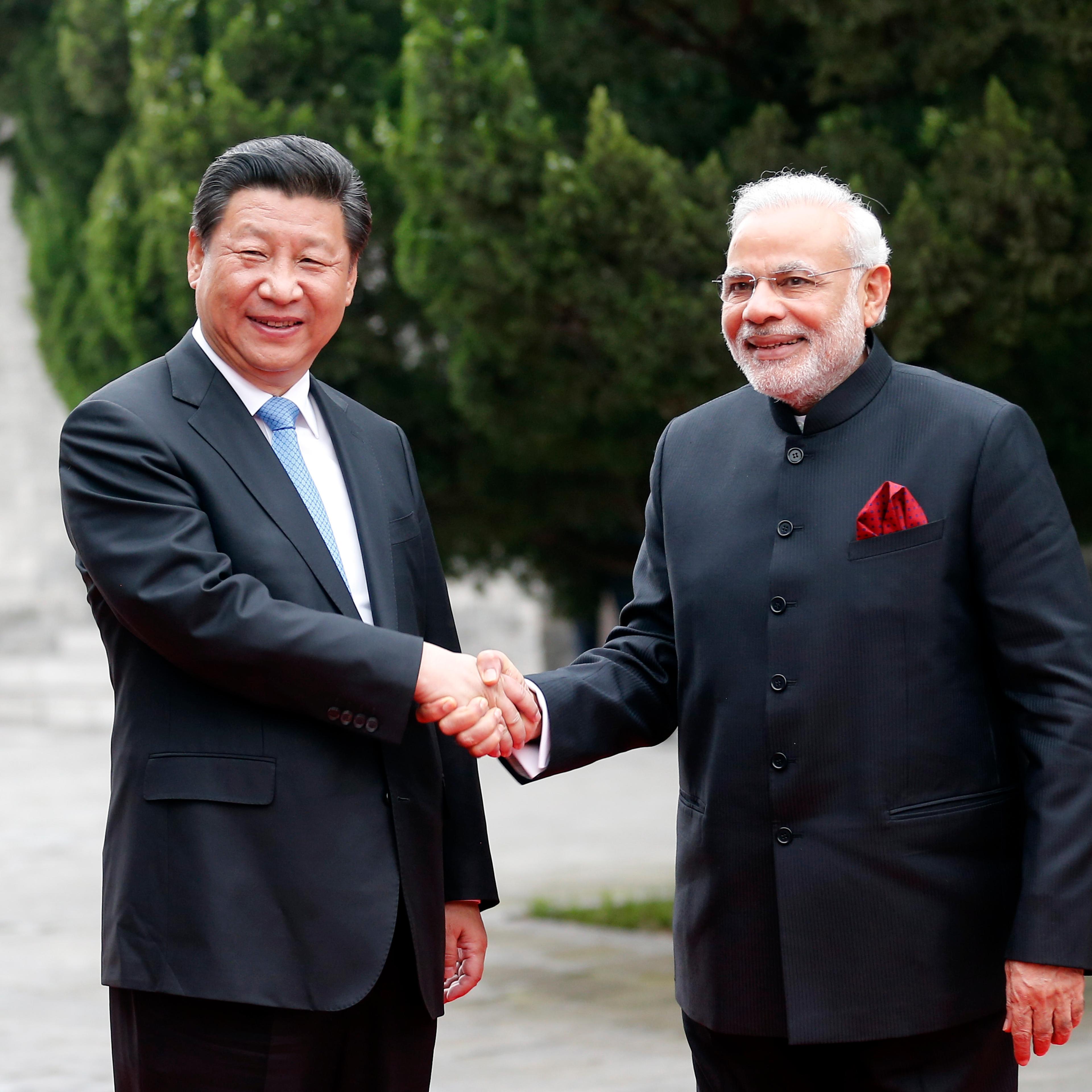 Chinese President Xi Jinping (L) and Indian Prime Minister Narendra Modi during their visit to Daci'en Temple in Xi'an, China on May 14, 2015.