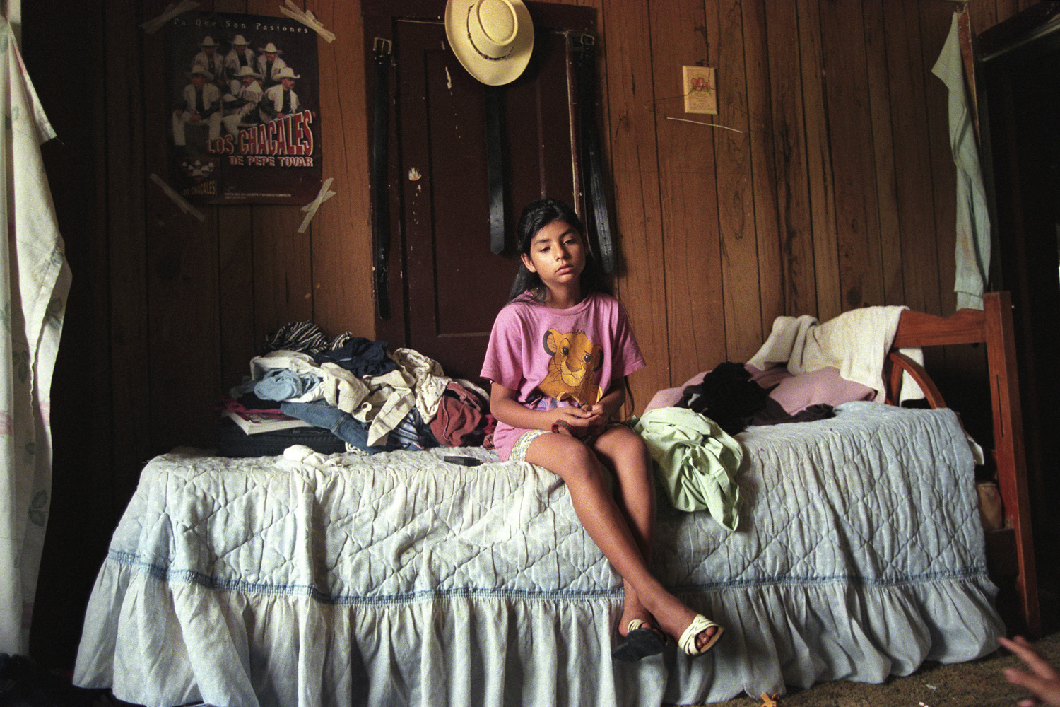 Texas, 2000. Marisol sits alone in her room, listening to the chaos of screaming parents and family members. Her family relocated to Texas soon after emigrating to Florida four years before. Tensions mounted between Marisol's parents and resulted in a bitter divorce that split her family in 2000.
