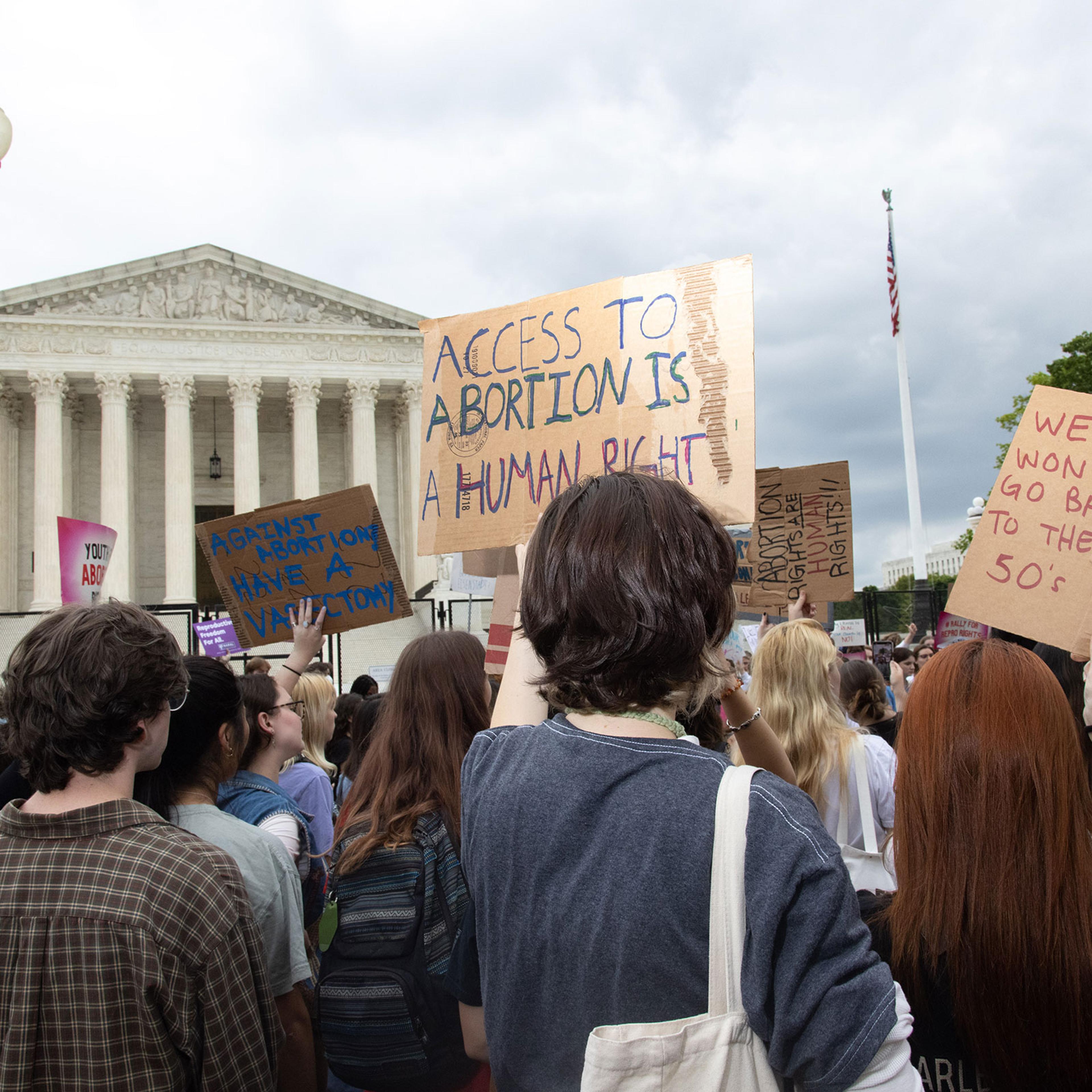 Youth pro-abortion rights demonstrators rally outside Supreme Court
