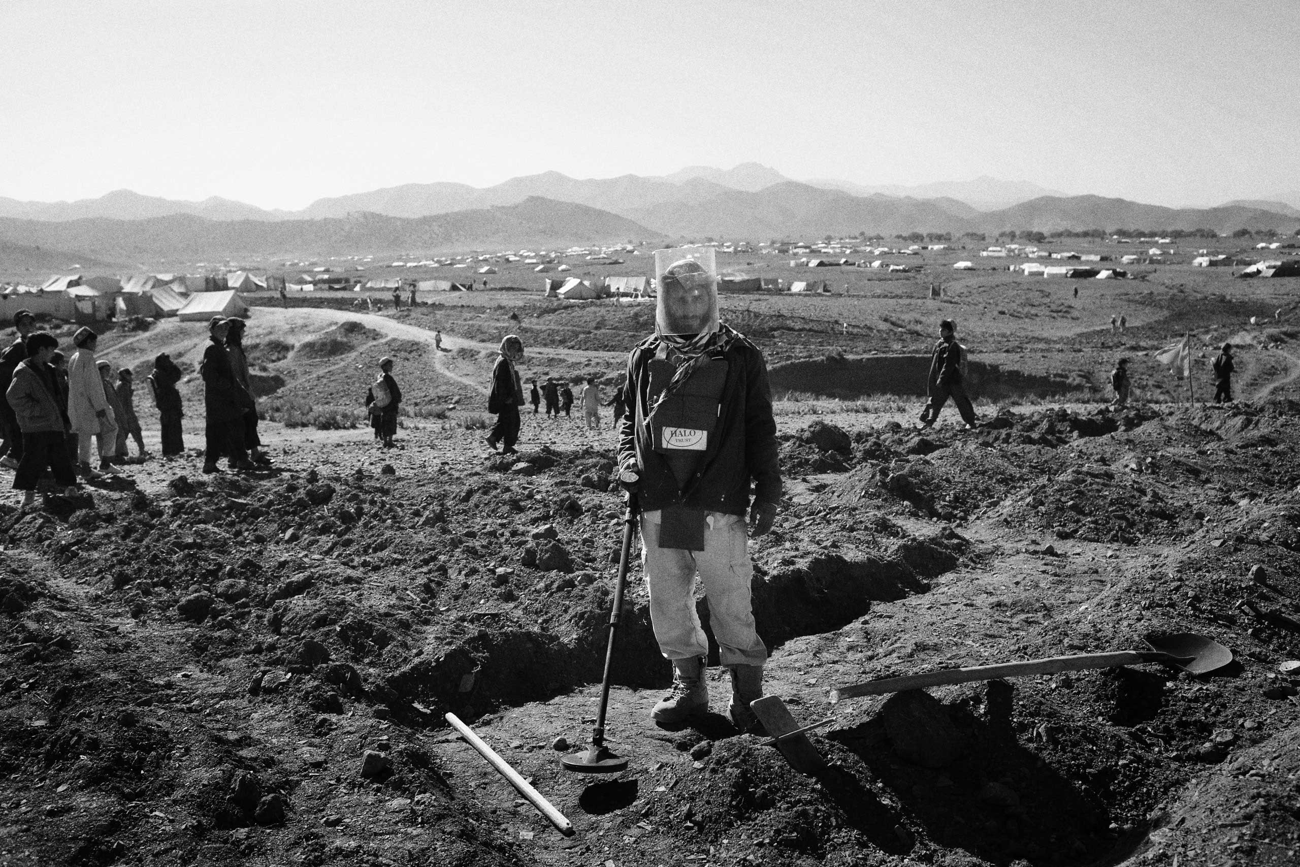 A de-miner from the NGO, Halo Trust works at a site in the Gulan refugee camp in Khost Province, Afghanistan. Halo Trust is one of the organisations responsible for the process which began after anti-tank mines and unexploded ordinance was discovered on 