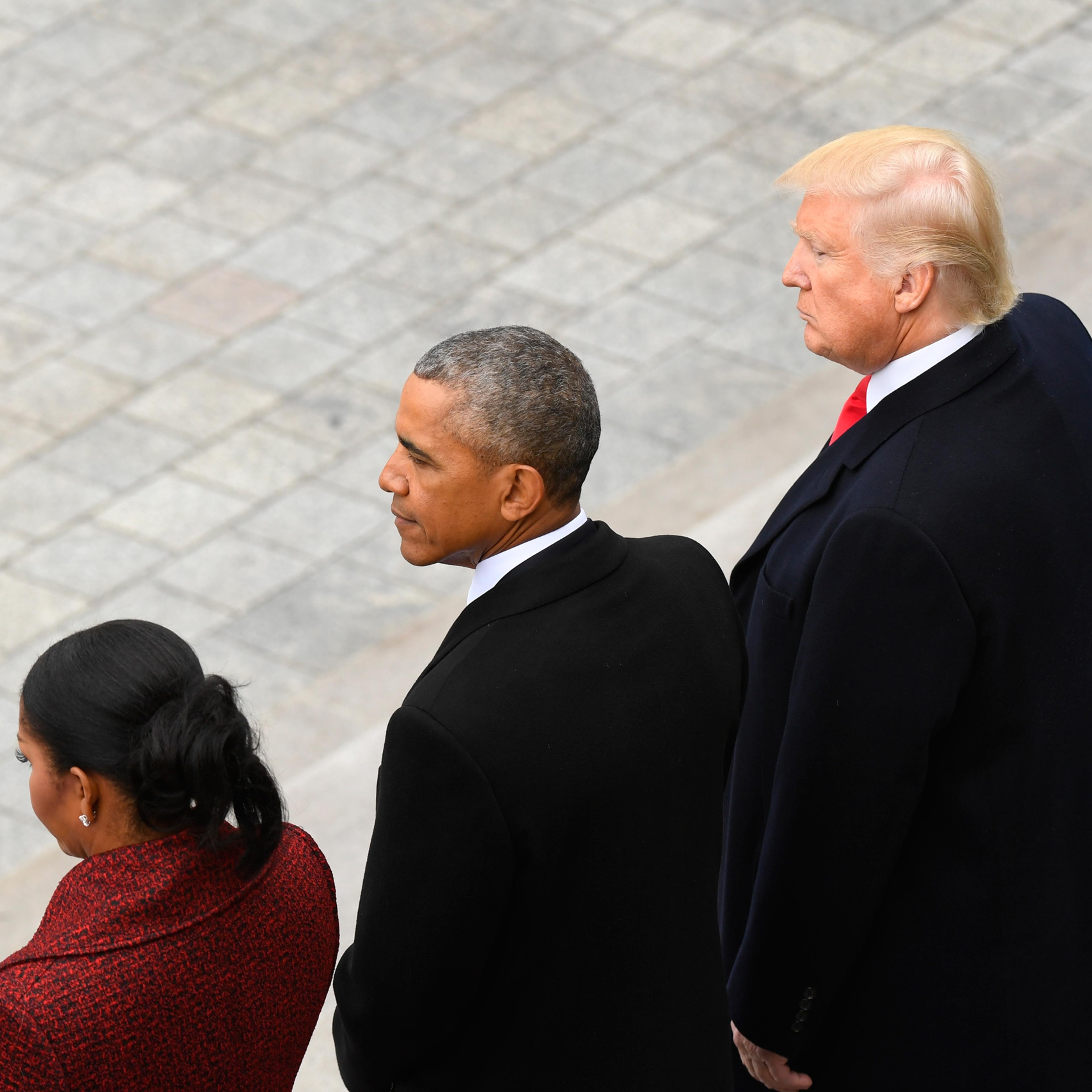 Former President Barack Obama and his wife Michelle Obama stand with President Donald Trump and his wife Melania Trump on the East front of the Capitol Hill in Washington, Friday, Jan. 20, 2017, prior to the Obama's departure from the presidential inaugu