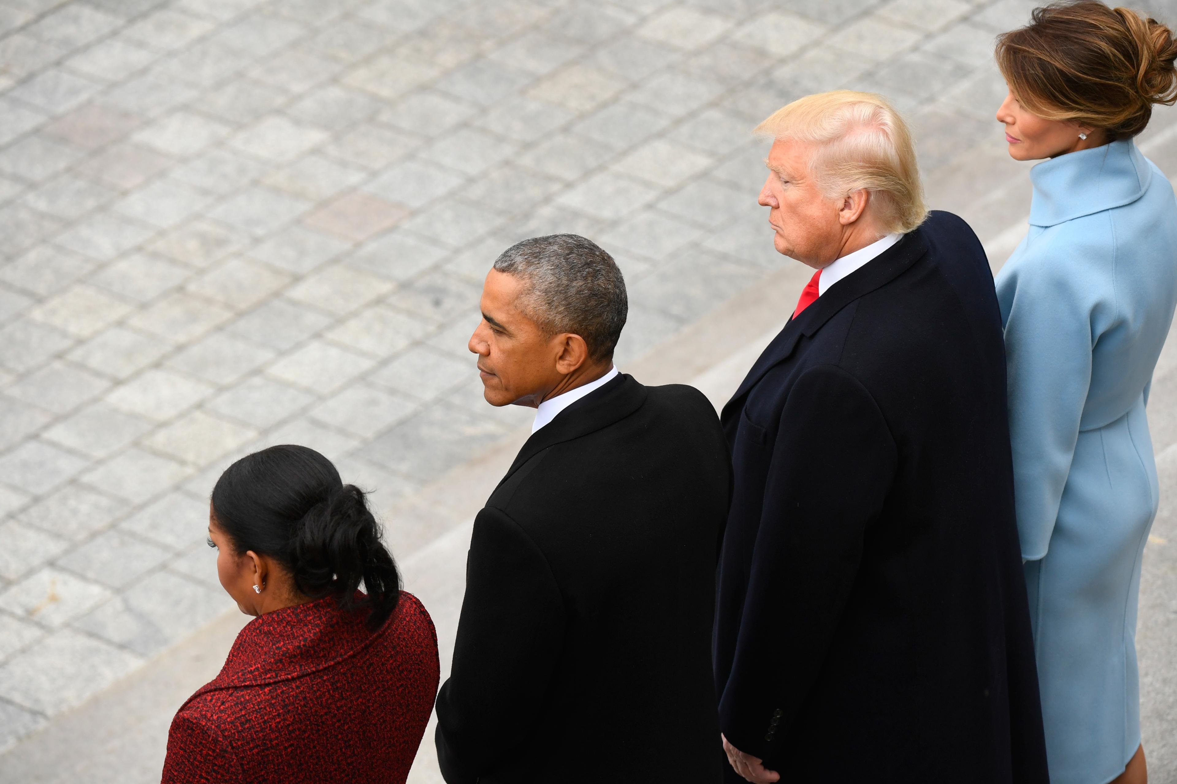 Former President Barack Obama and his wife Michelle Obama stand with President Donald Trump and his wife Melania Trump on the East front of the Capitol Hill in Washington, Friday, Jan. 20, 2017, prior to the Obama's departure from the presidential inaugu
