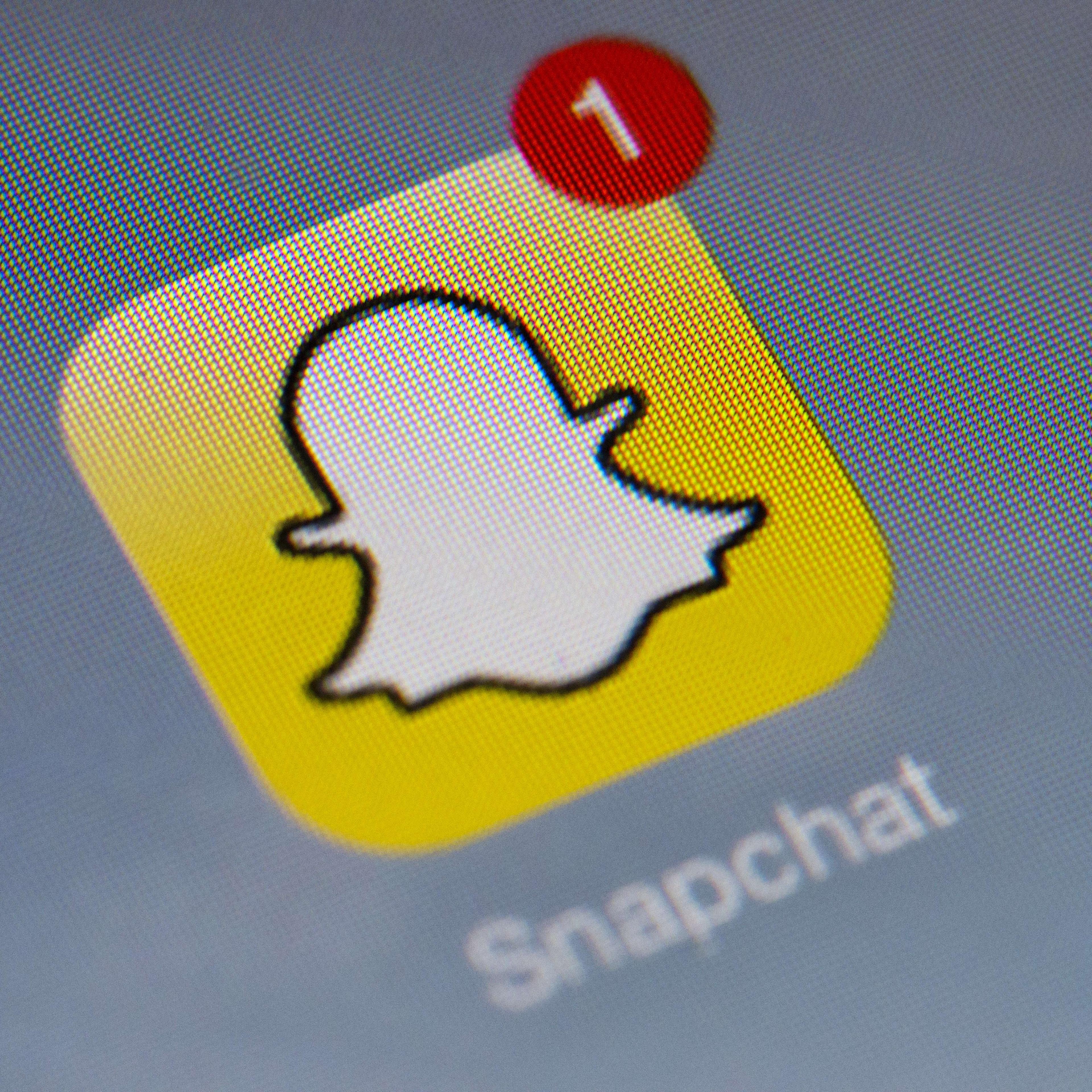 The logo of mobile app "Snapchat" is displayed on a tablet on January 2, 2014 in Paris.