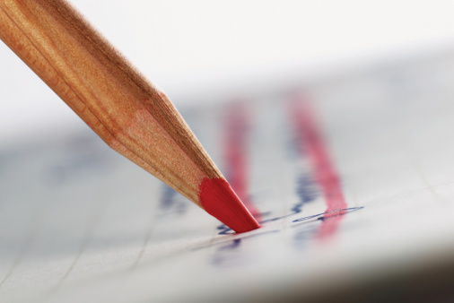 red-colored-pencil-crossing-out