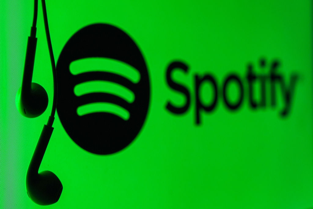 A mobile phone screen displays the Spotify logo with a headset in Ankara, Turkiye on May 1, 2024.