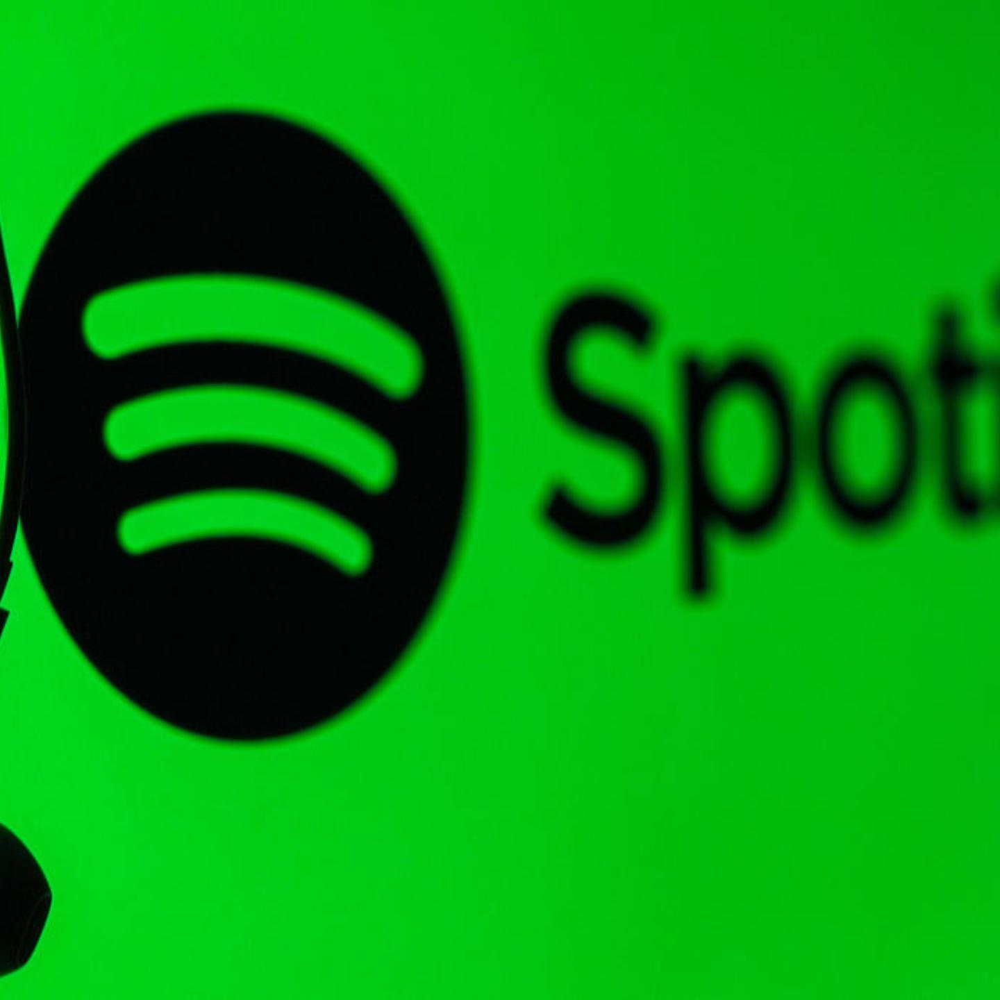 A mobile phone screen displays the Spotify logo with a headset in Ankara, Turkiye on May 1, 2024.