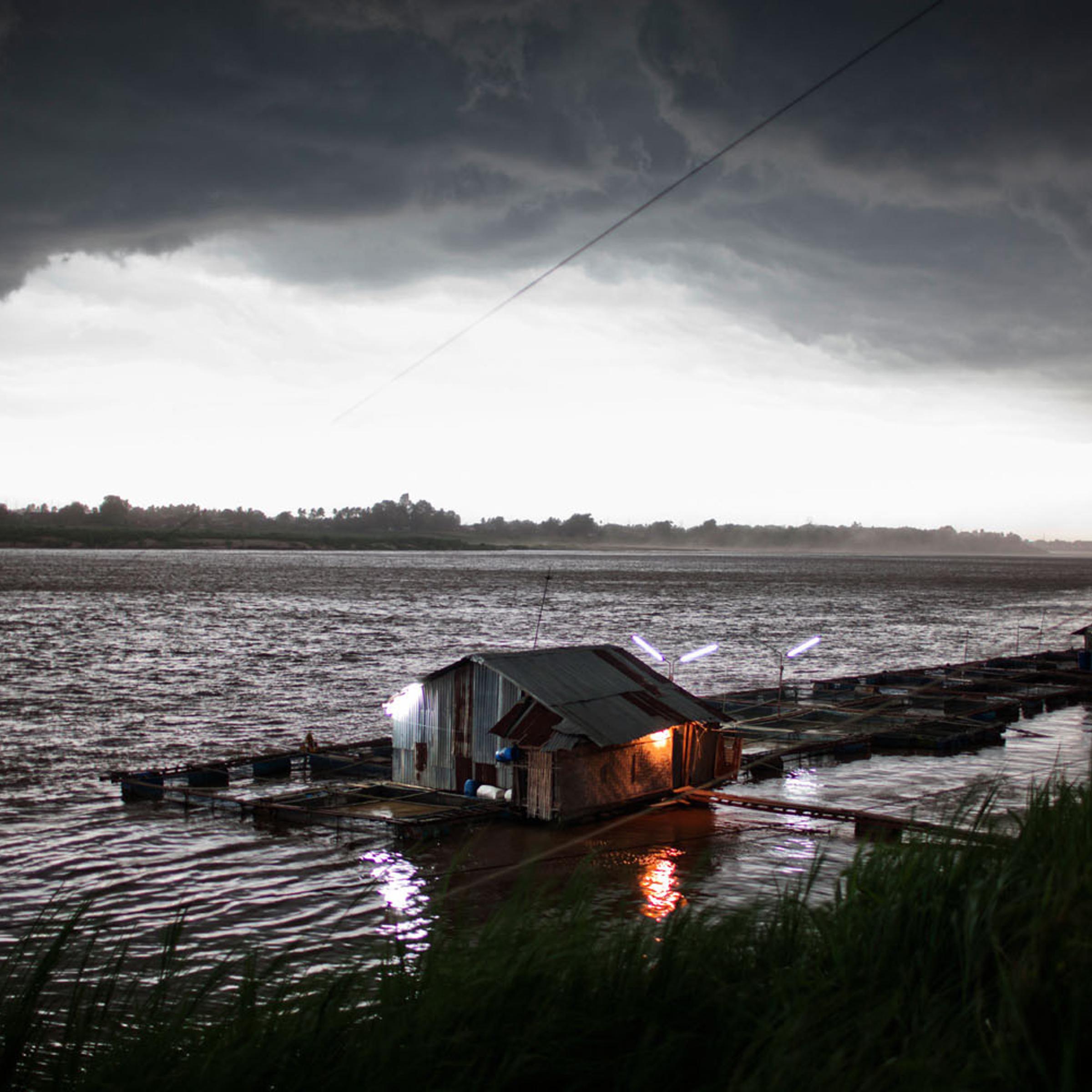 An afternoon storm approaches a fish farm on the Mekong River in Vientiane, Laos People’s Democratic Republic on May 12, 2011.