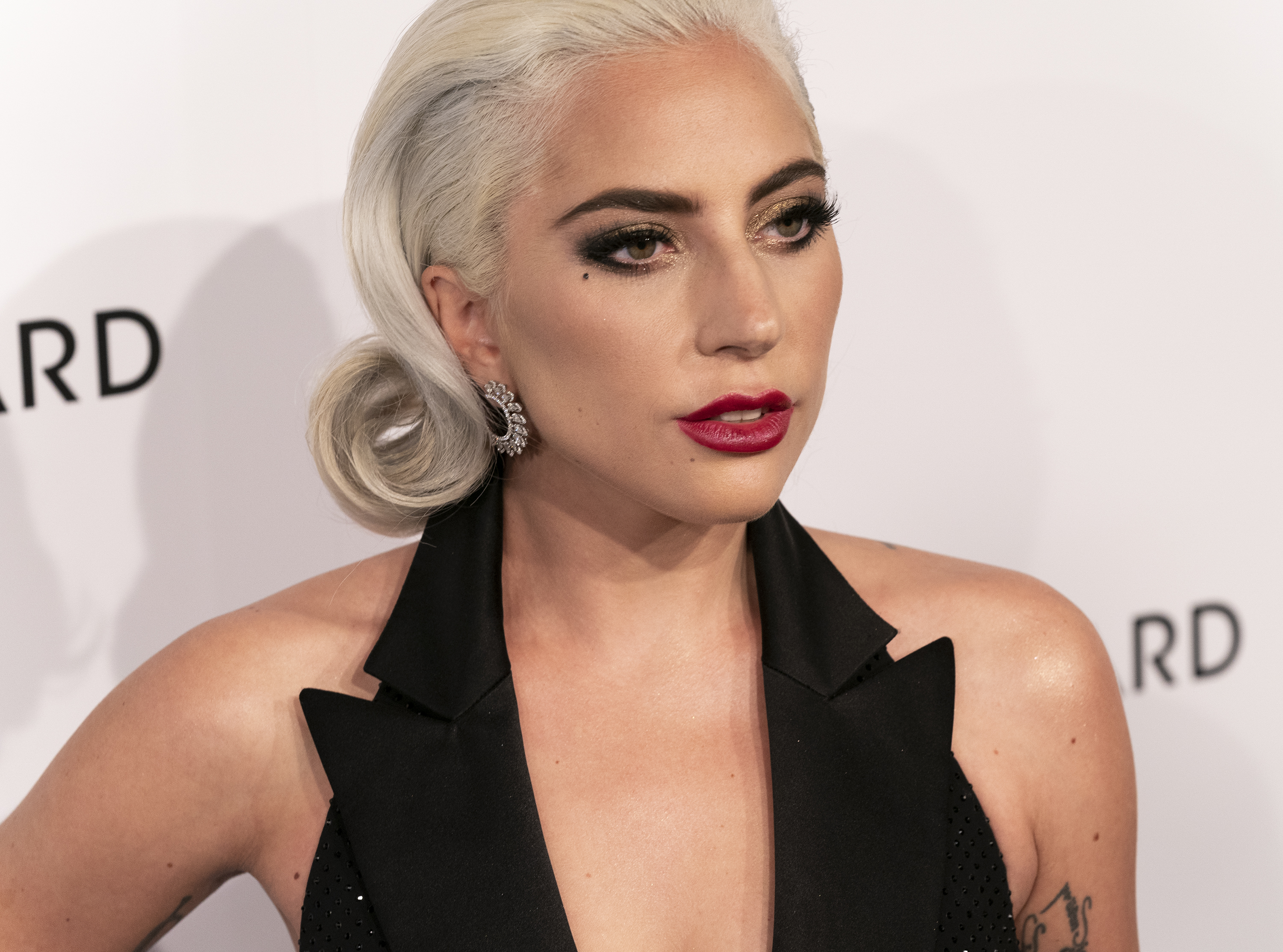 Lady Gaga wearing dress by Ralph Lauren Collective attends