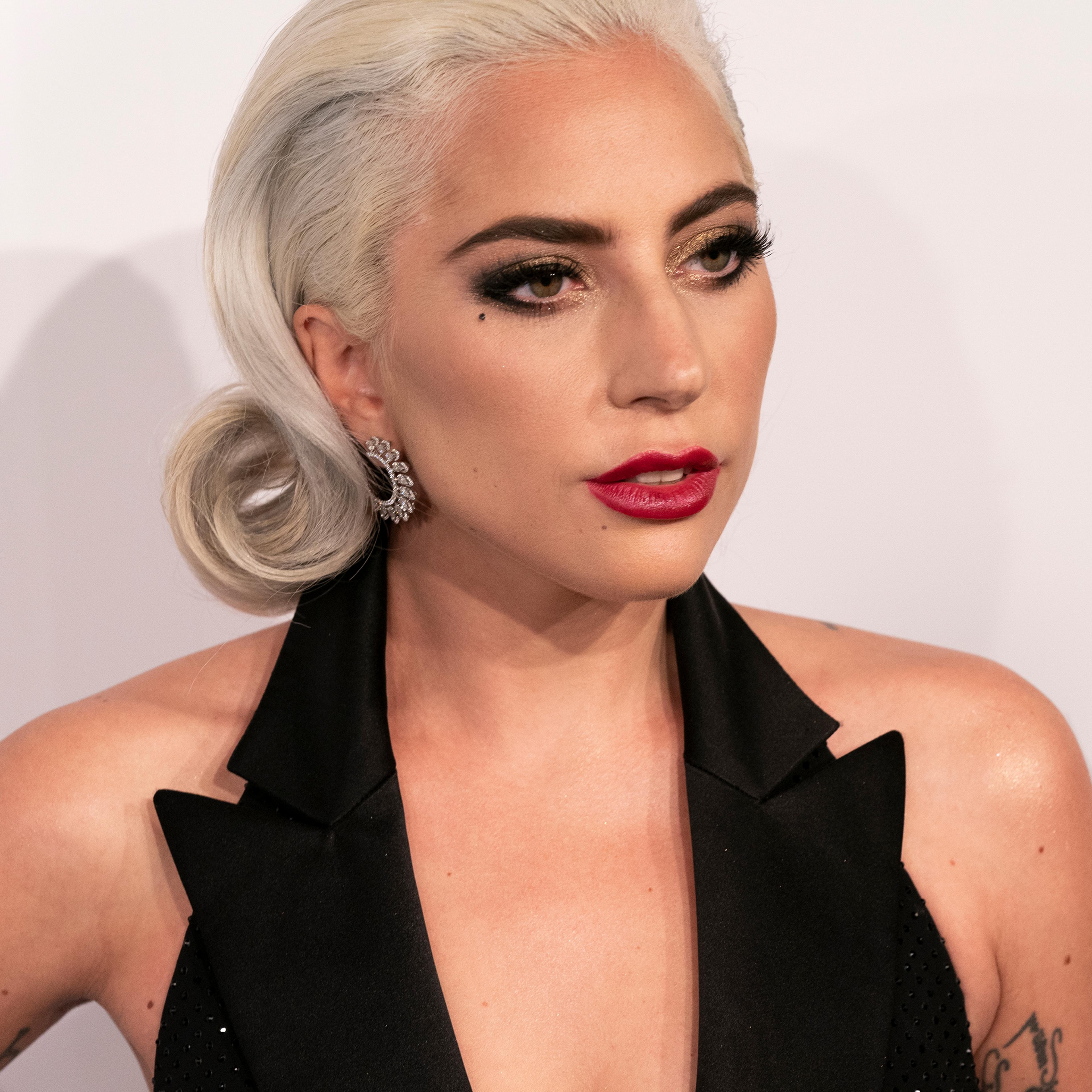 Lady Gaga wearing dress by Ralph Lauren Collective attends