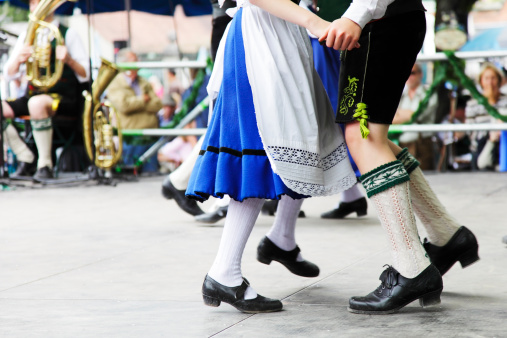 Bavarian couple dancing at Oktoberfest