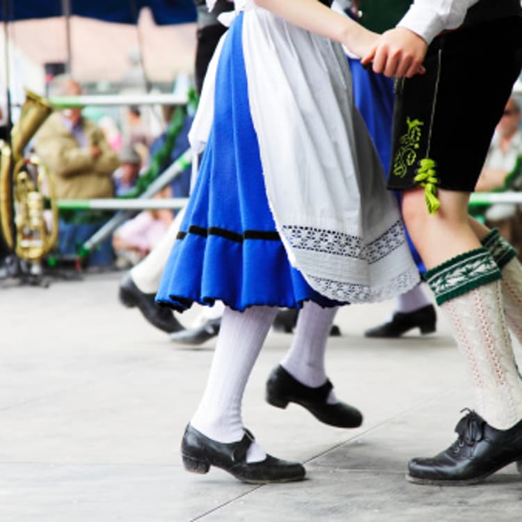 Bavarian couple dancing at Oktoberfest