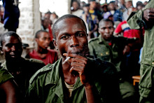 February 21, 2011. Sido Bizinungu, a close associate of Lt. Col. Mutuare Daniel Kibibi, smokes a cigarette after being convicted of crimes against humanity in the town of Baraka, Congo. Nearly 50 women poured out their stories in a wave of anguish that ended with the conviction of an army colonel for crimes against humanity—a landmark verdict in this Central African country where thousands are believed to be raped each year by soldiers and militia groups who often go unpunished. 