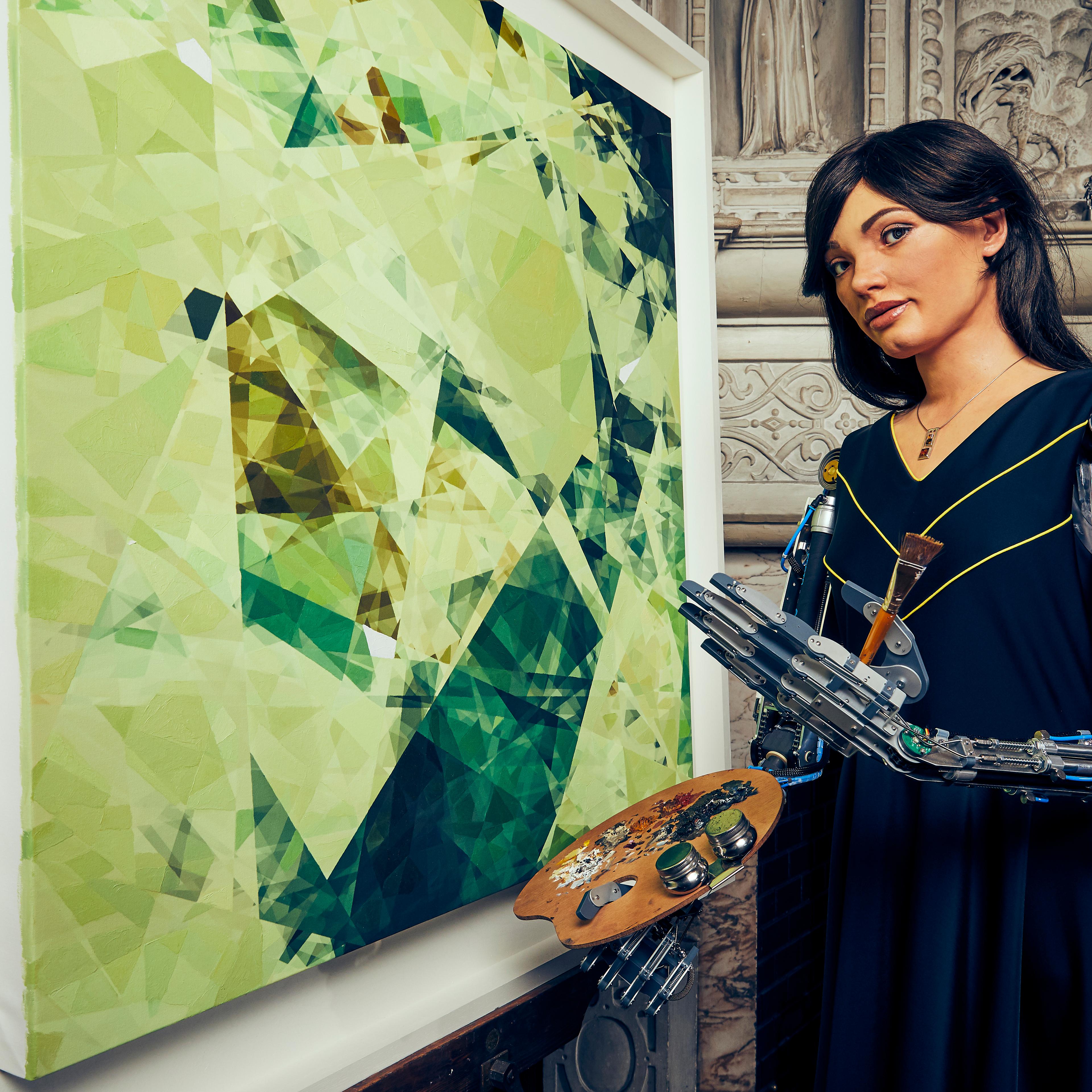 Ai-Da Robot with a painting created by her response to an oak tree