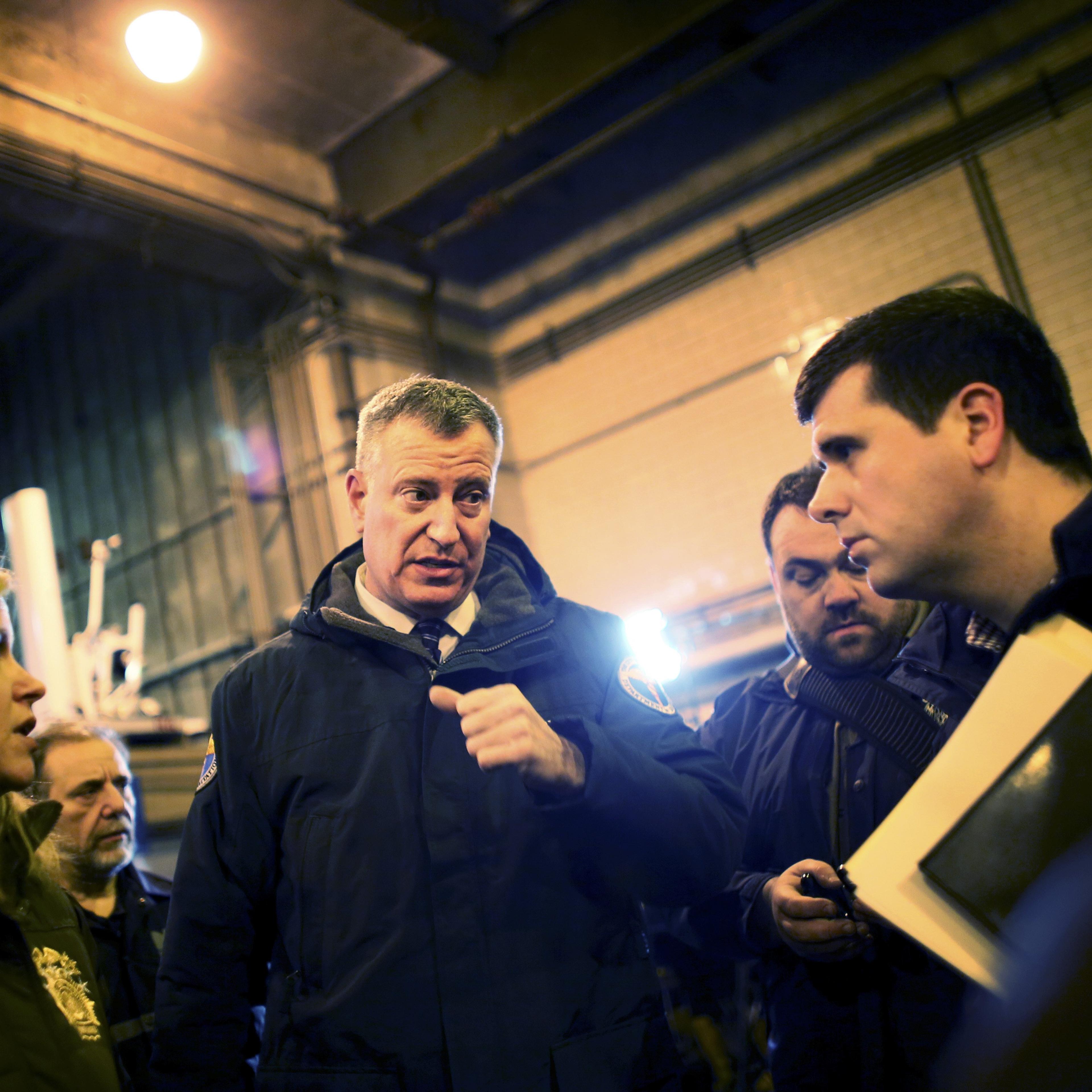 New York City Mayor Bill de Blasio exits a news conference with Department of Sanitation workers in New York.