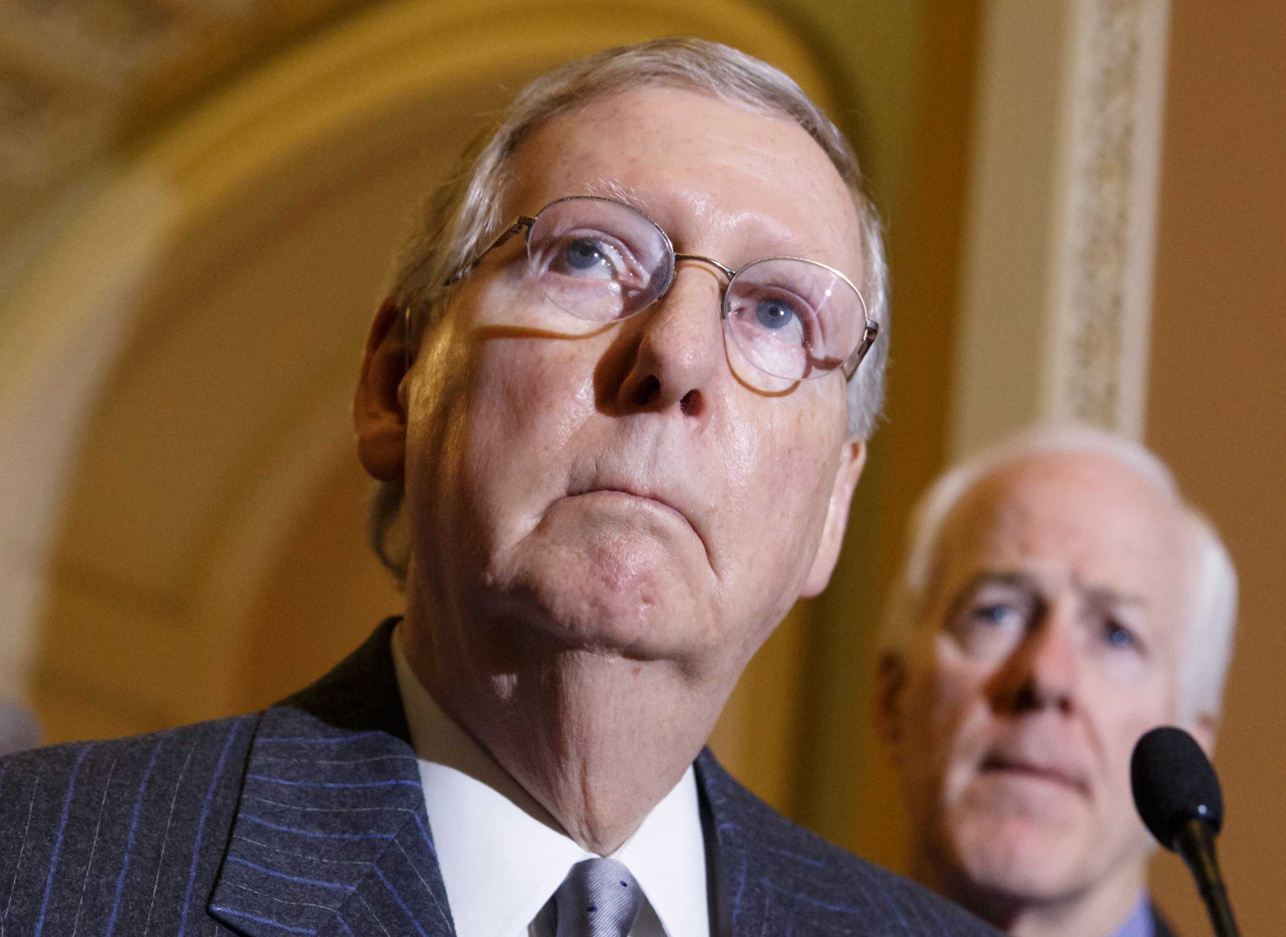 Senate Majority Leader Mitch McConnell of Ky., left, joined by Senate Majority Whip John Cornyn of Texas, meets with reporters on Capitol Hill in Washington, Jan. 27, 2015, to discuss the status of the Keystone XL Pipeline bill, following their weekly po