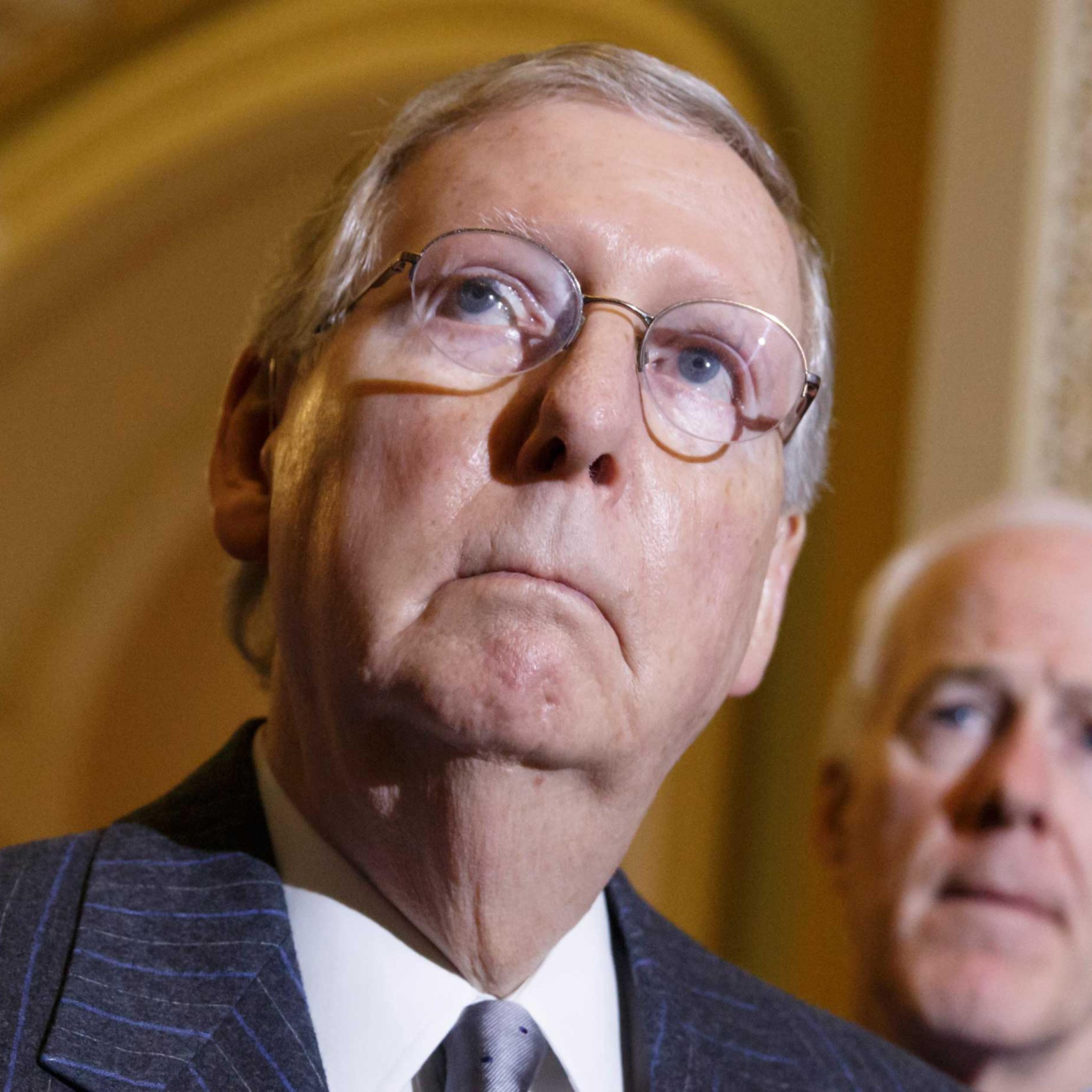Senate Majority Leader Mitch McConnell of Ky., left, joined by Senate Majority Whip John Cornyn of Texas, meets with reporters on Capitol Hill in Washington, Jan. 27, 2015, to discuss the status of the Keystone XL Pipeline bill, following their weekly po