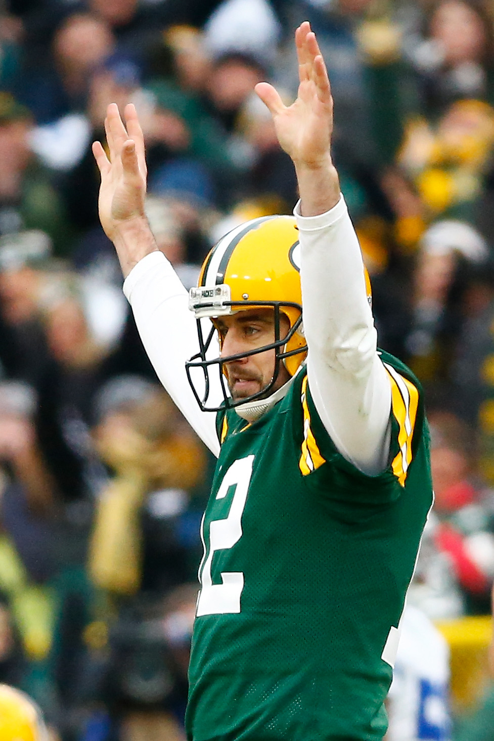 Aaron Rodgers of the Green Bay Packers reacts after completing a pass during the 2015 NFC Divisional Playoff game on Jan. 11, 2015 in Green Bay, Wisconsin.