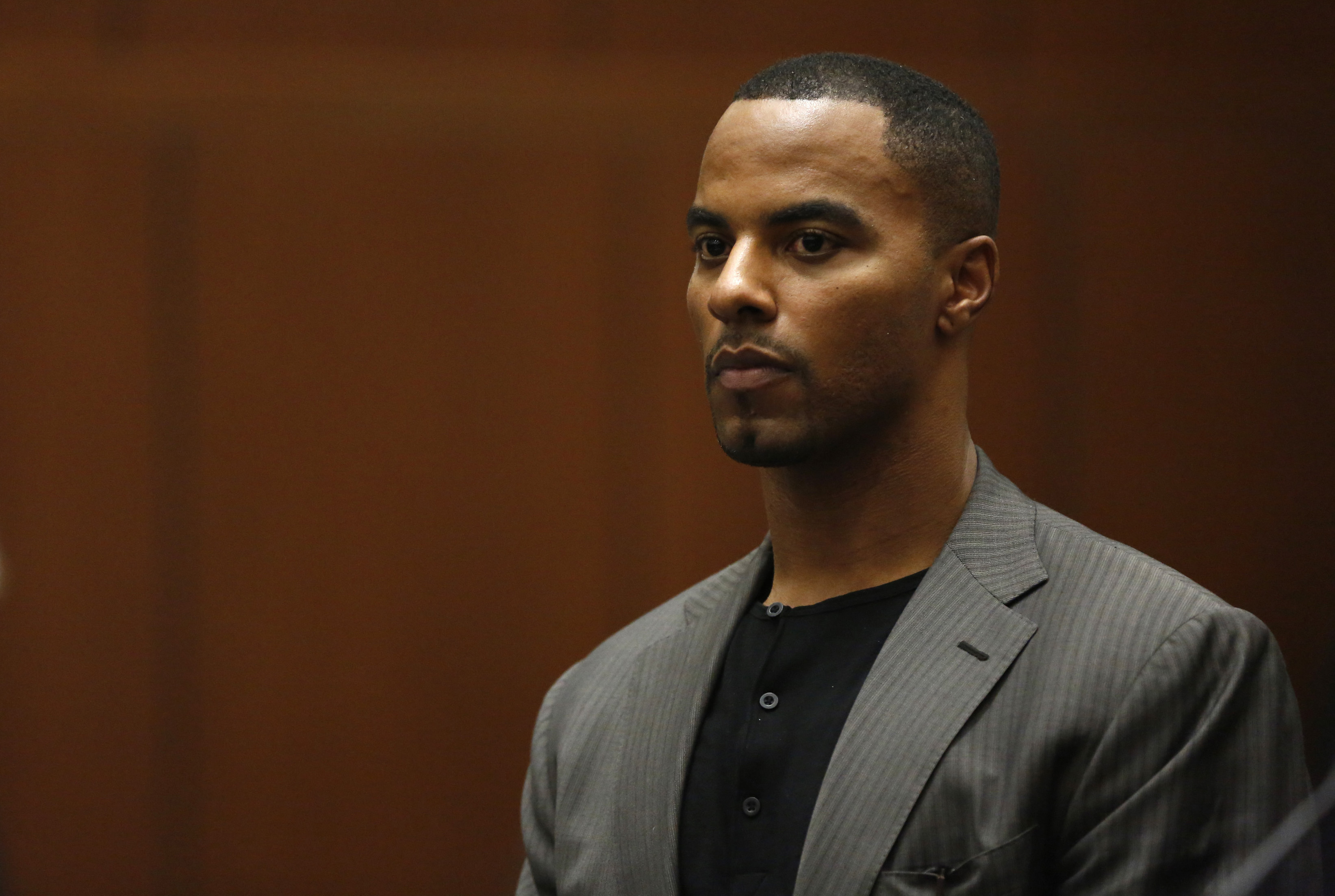 Former professional football player Darren Sharper appears for his arraignment in Los Angeles, Ca on Feb. 20, 2014
