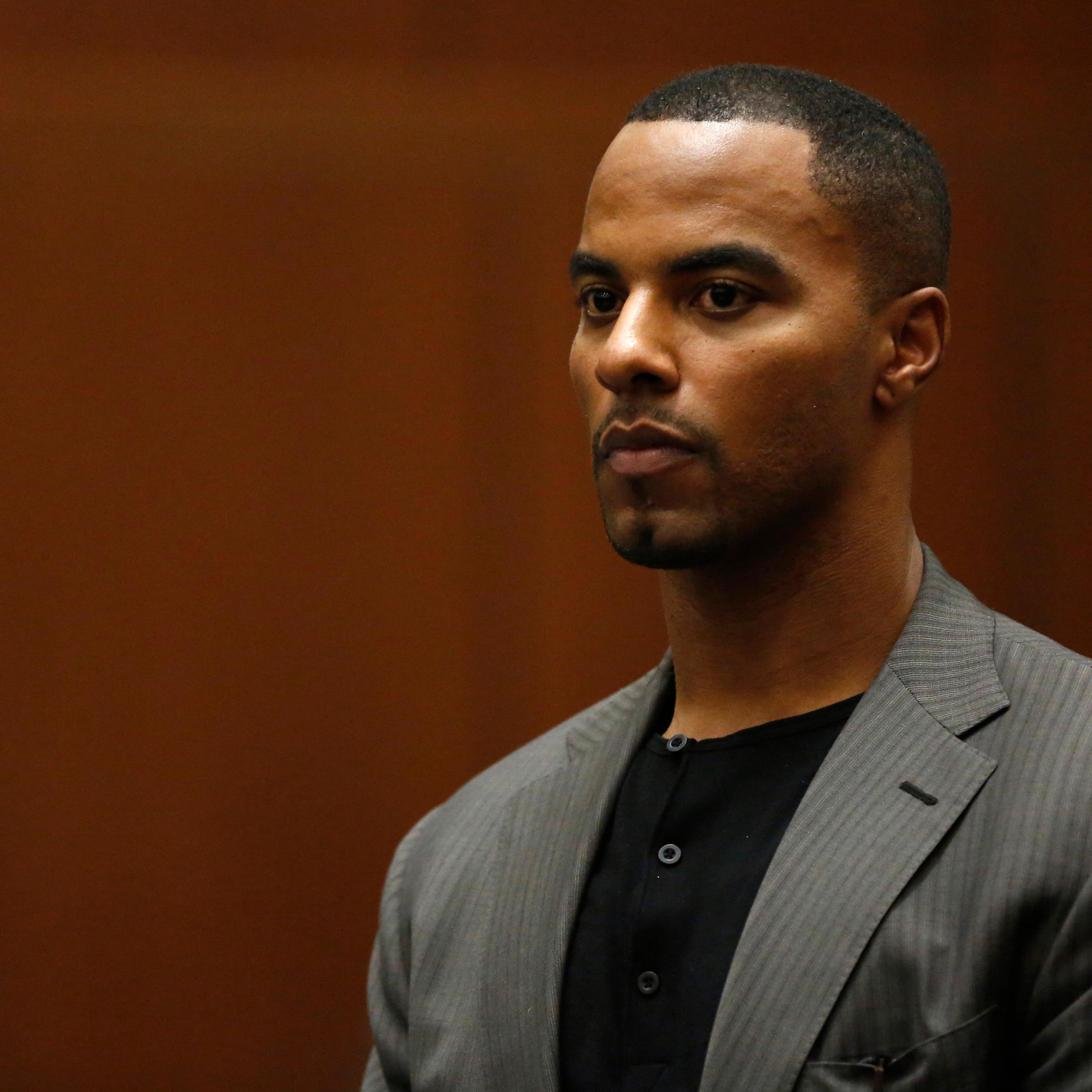 Former professional football player Darren Sharper appears for his arraignment in Los Angeles, Ca on Feb. 20, 2014