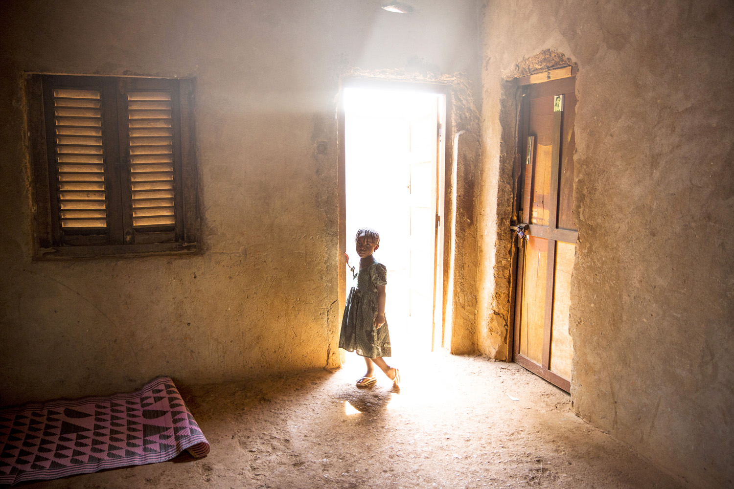 A young girl whose family member Fleuri Doumana, 21, was killed 2 days before by a grenade launched by a member of the Seleka. The rebel group that took power in March 2013 carries out numerous exactions such as murders, kidnapping, torture... Bangui.