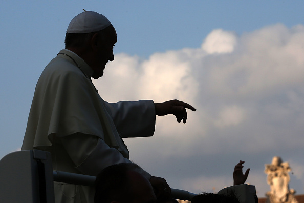 Pope Francis waves to the faithful as he arrives in St. Peter's Square for a meeting with the Roman Diocesans on June 14, 2015 in Vatican City, Vatican.