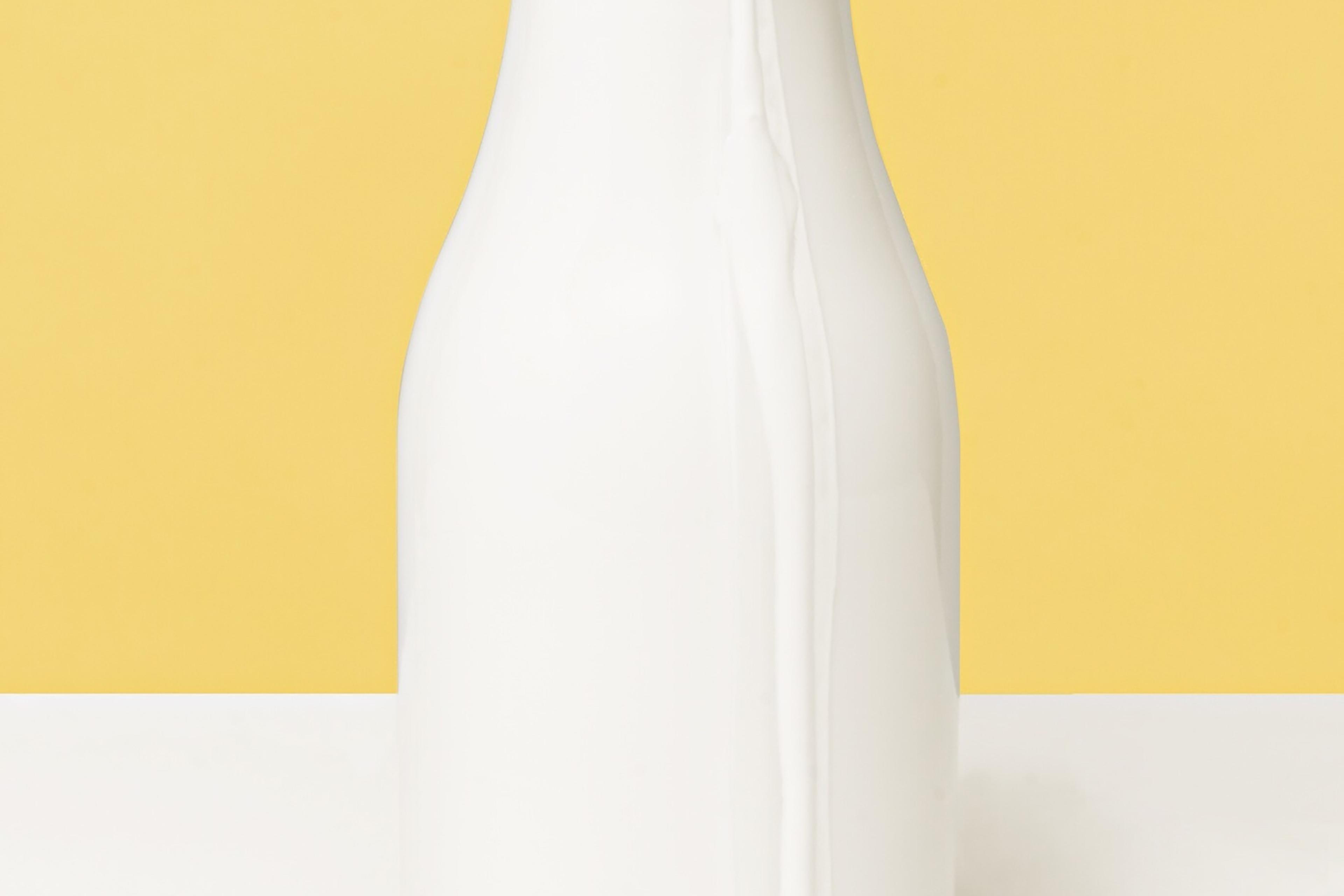 Close-Up Of Milk Bottle On Table