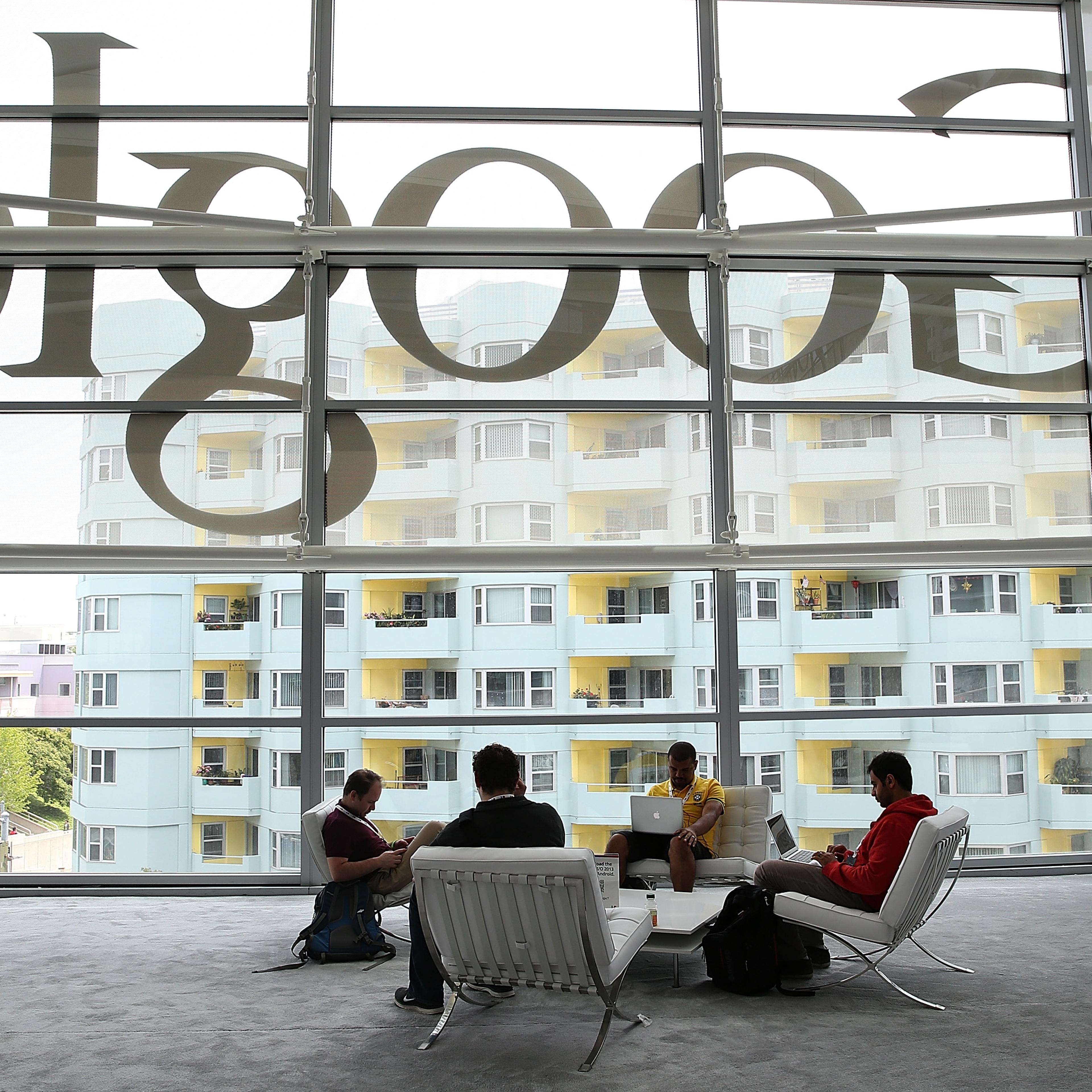 Attendees work on laptops during the Google I/O developers conference at the Moscone Center on May 15, 2013 in San Francisco.