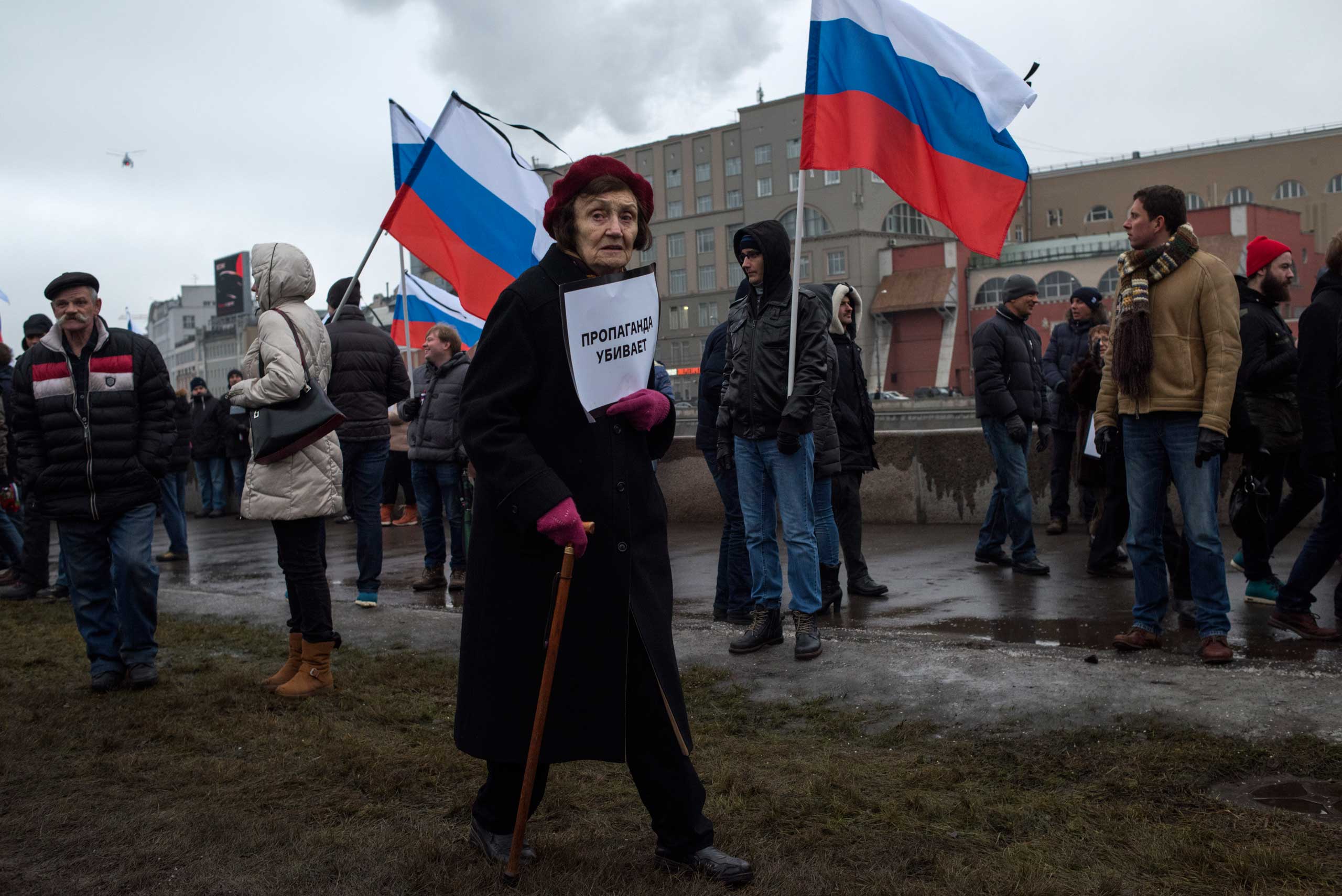 Moscow, Russia, Sunday, March 1, 2015. People carry a huge banner reading 'those bullets for everyone of us, heroes never die!' as they march in memory of opposition leader Boris Nemtsov who was gunned down on Friday, Feb. 27, 2015 near the Kremlin.Thous