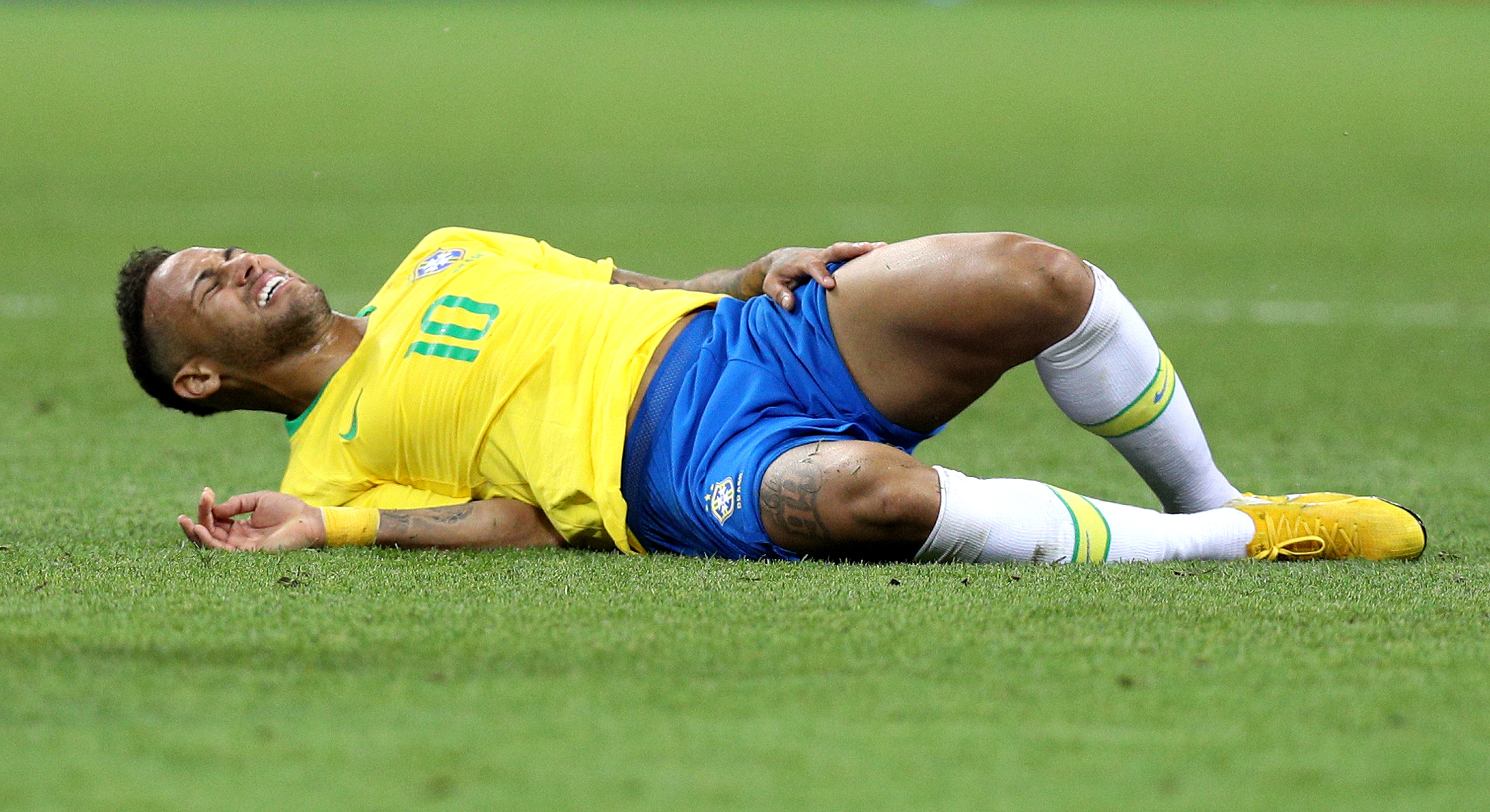 Neymar of Brazil reacts at full time with Belgium