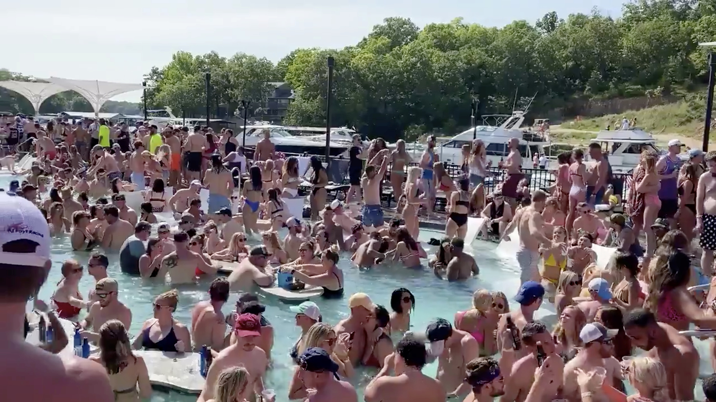 Revelers celebrate Memorial Day weekend at Osage Beach of the Lake of the Ozarks, Missouri, U.S., May 23 in this screen grab taken from social media video