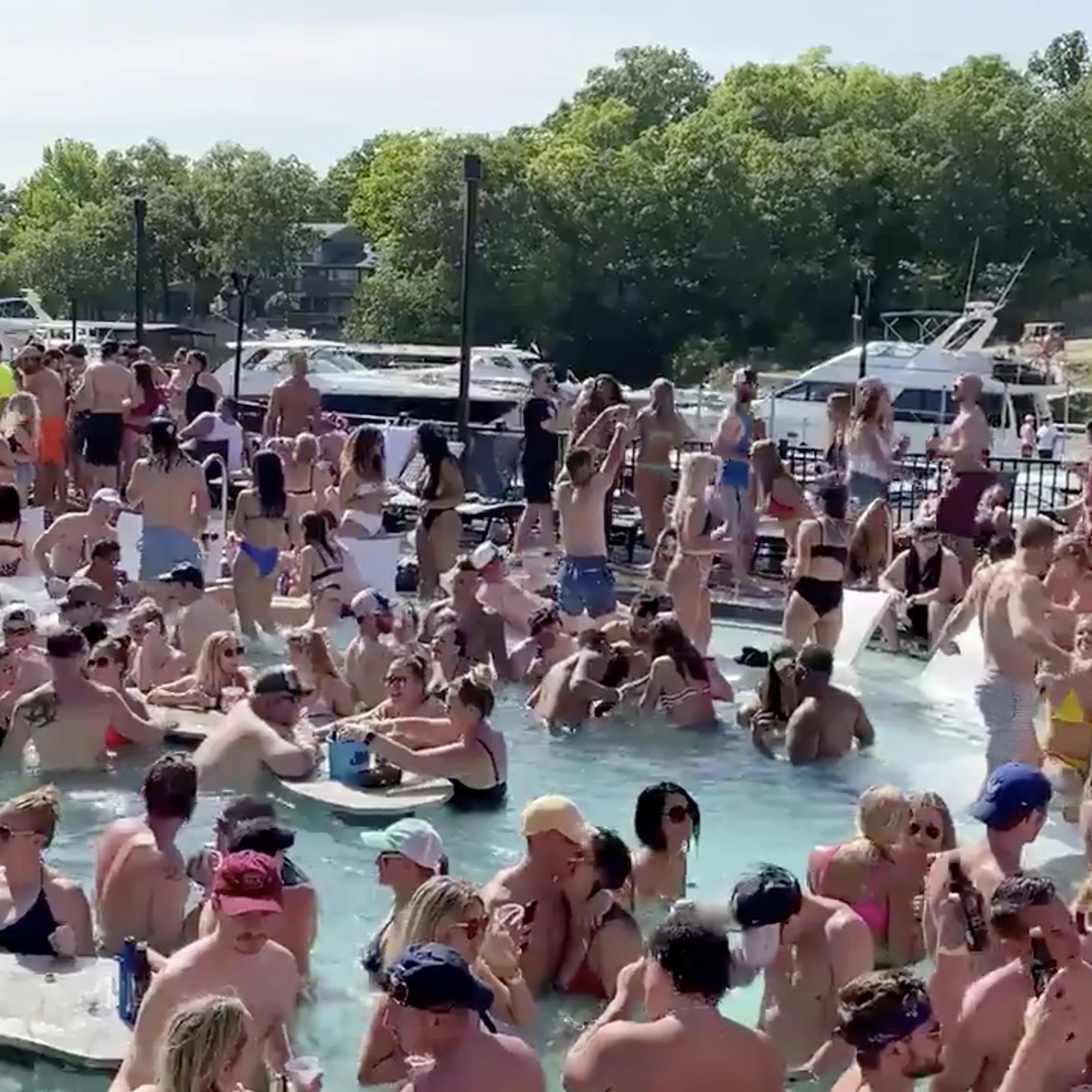 Revelers celebrate Memorial Day weekend at Osage Beach of the Lake of the Ozarks, Missouri, U.S., May 23 in this screen grab taken from social media video