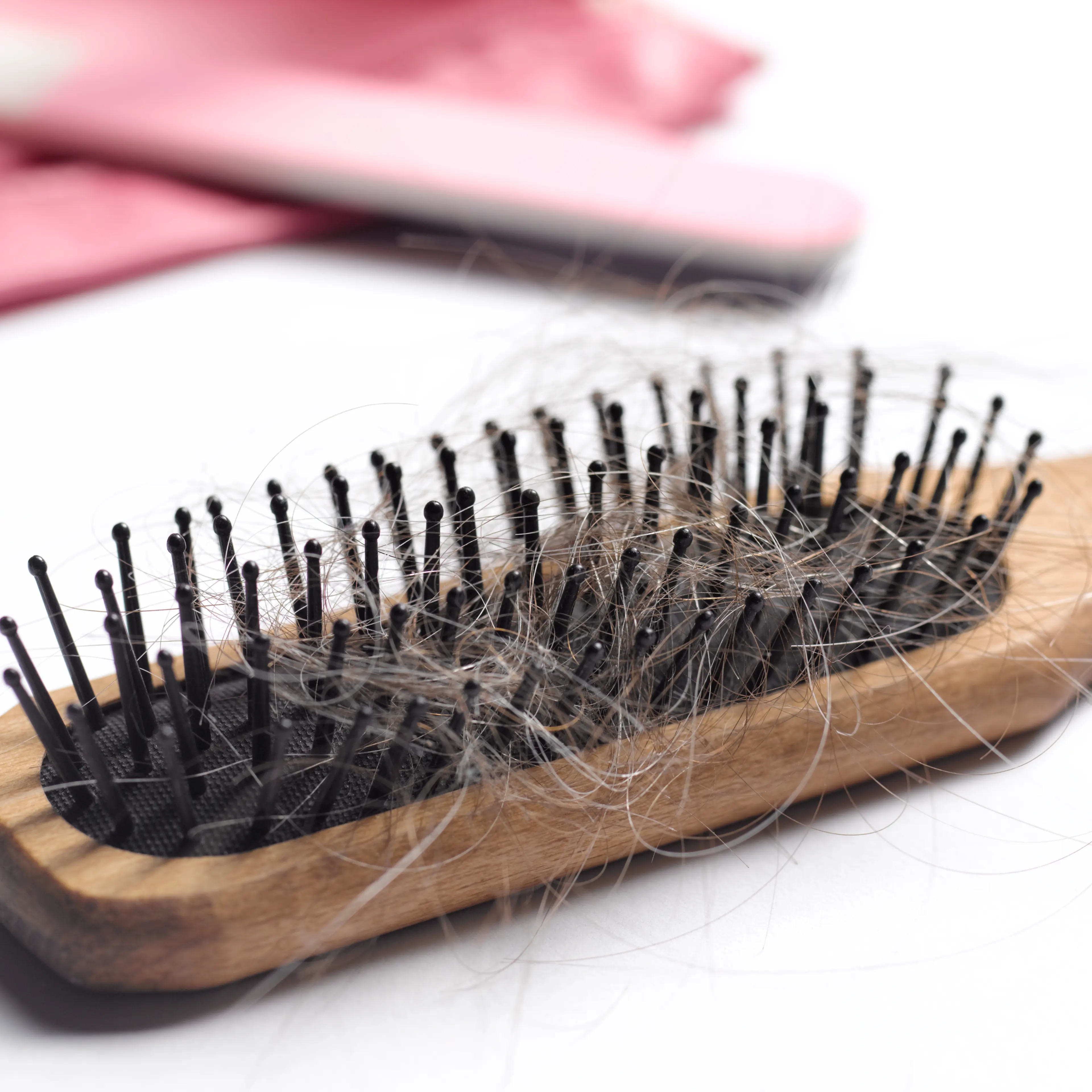 Hair brush with hair in it