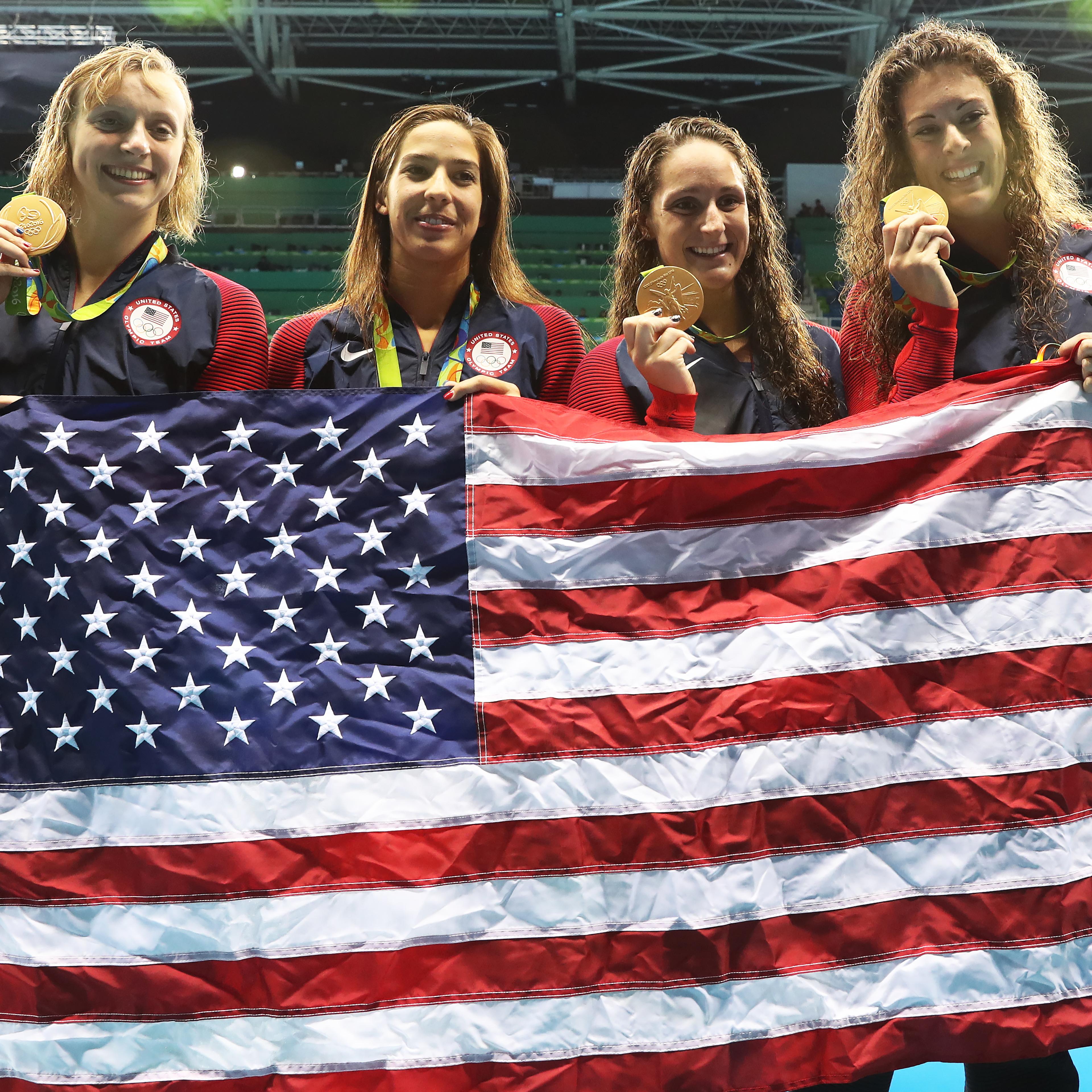Katie Ledecky, Maya Dirado, Leah Smith and Allison Schimdt of United States pose with their Gold medals from the Women's 4 x 20m Freestyle Relay on Day 5 of the Rio 2016 Olympic Games at the Olympic Aquatics Stadium in Rio de Janeiro on August 10, 2016.