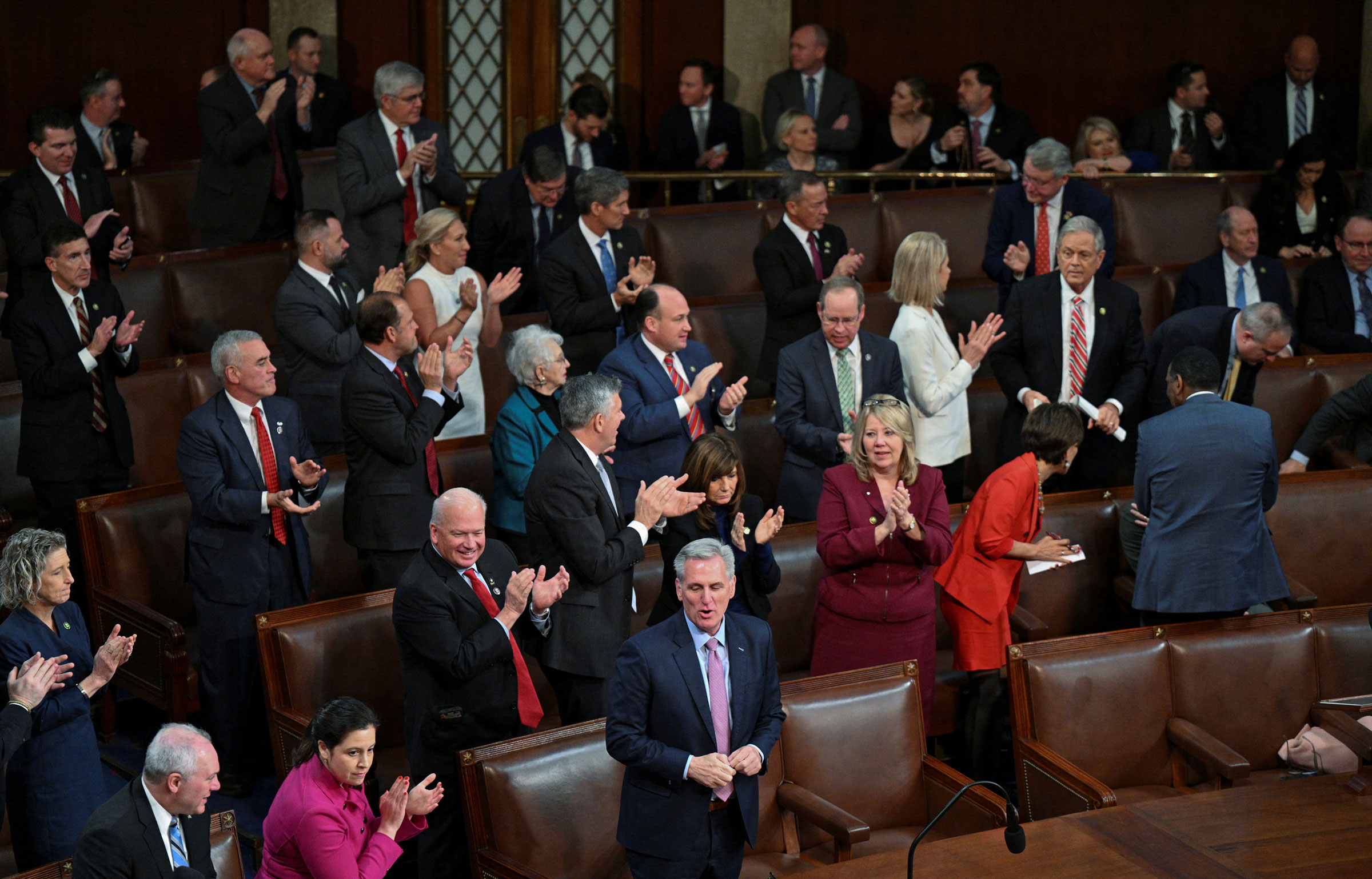 U.S. House Republican members cheer behind Republican Leader Kevin McCarthy