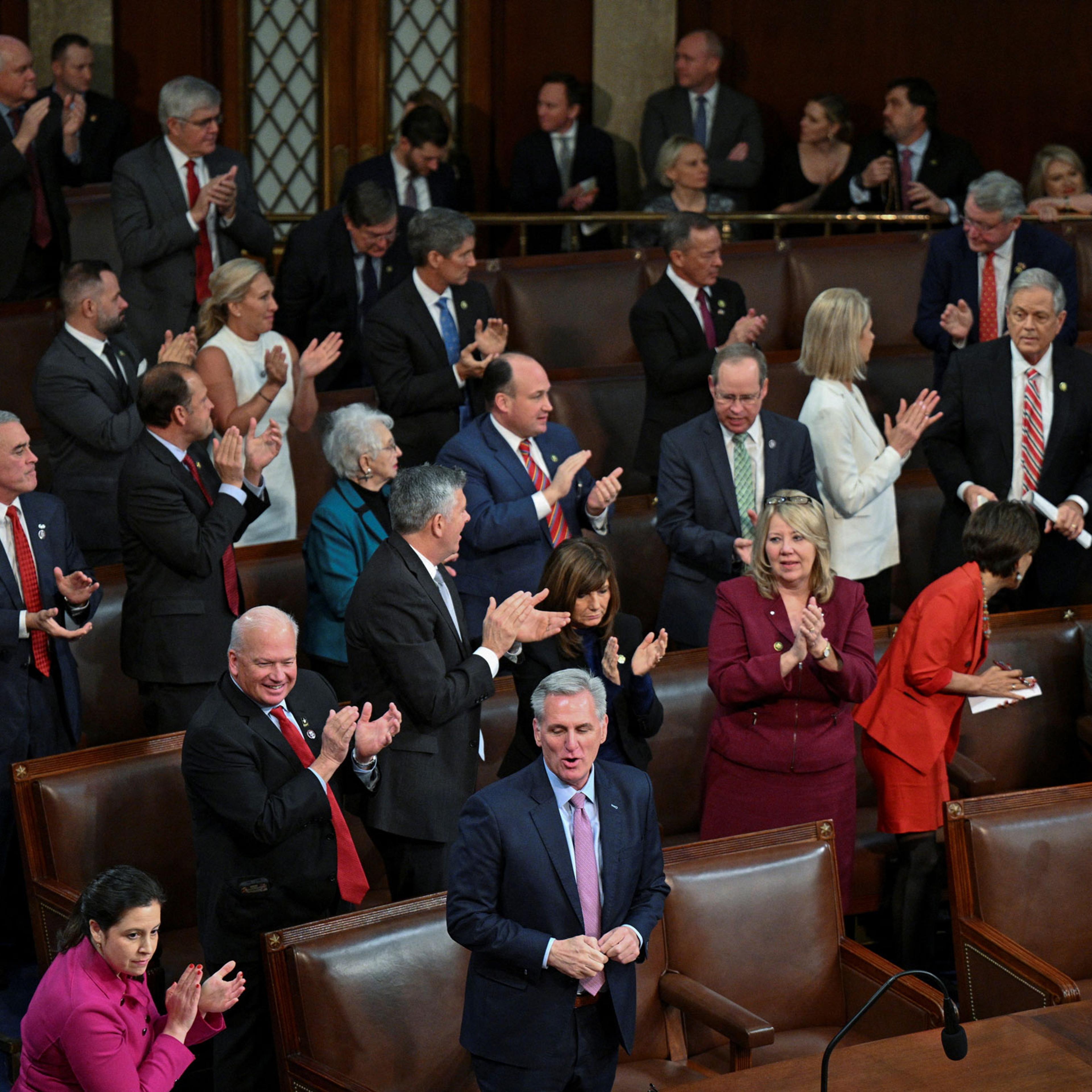 U.S. House Republican members cheer behind Republican Leader Kevin McCarthy