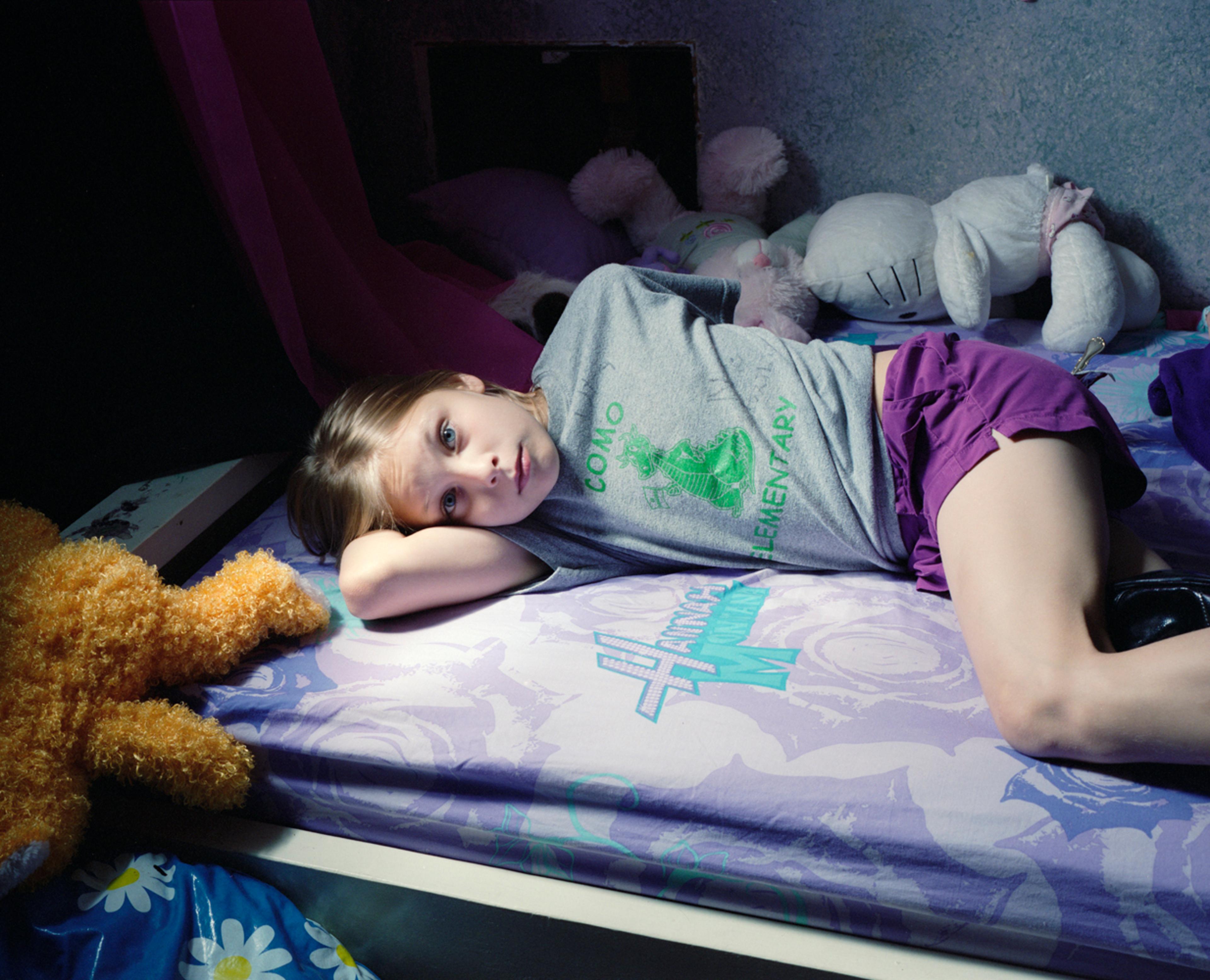 Surrounded by stuffed friends. 2009