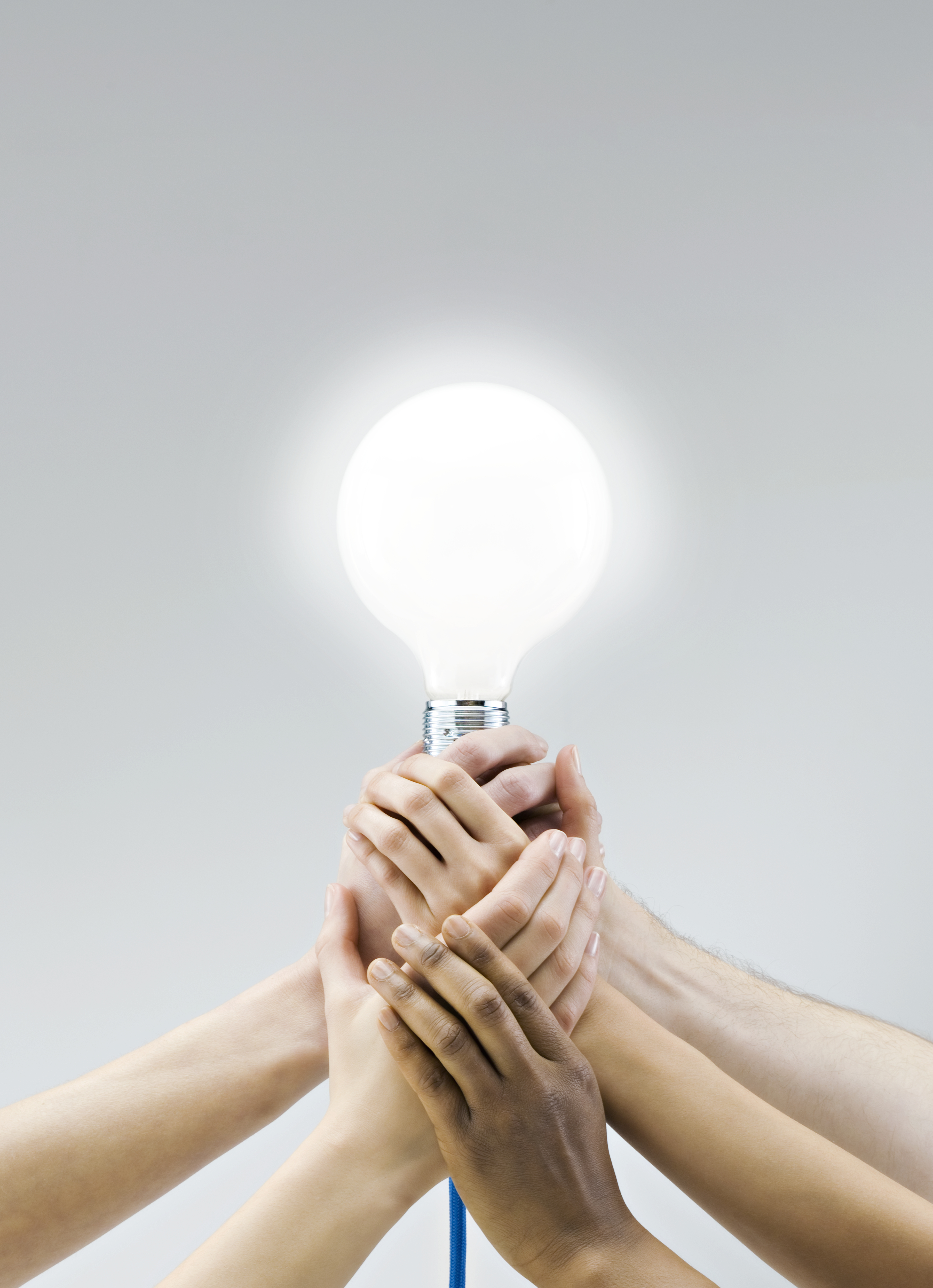 Hands on light bulb