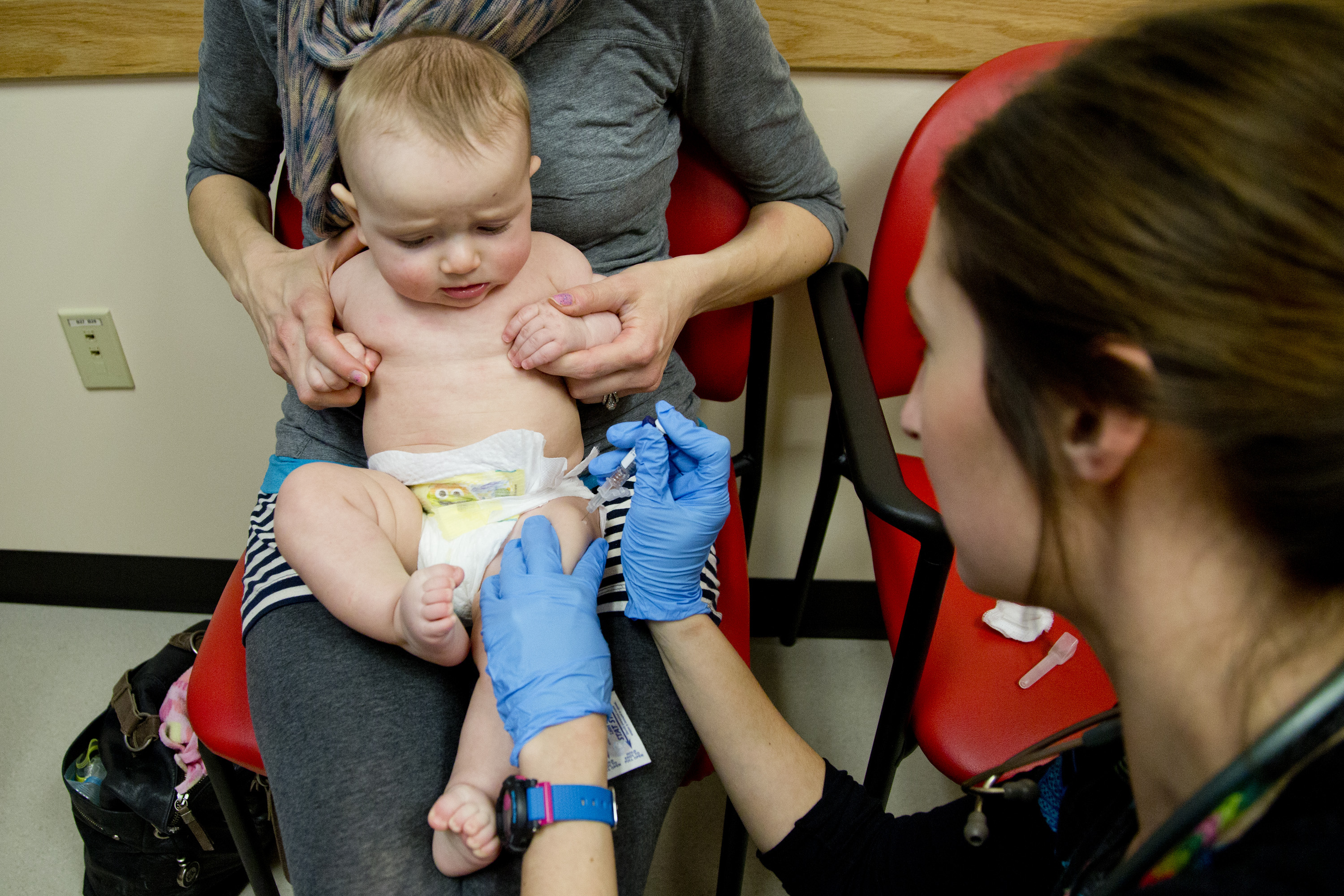 Sad baby, but smart mom: a child is vaccinated against meningitis in Portland, Me.