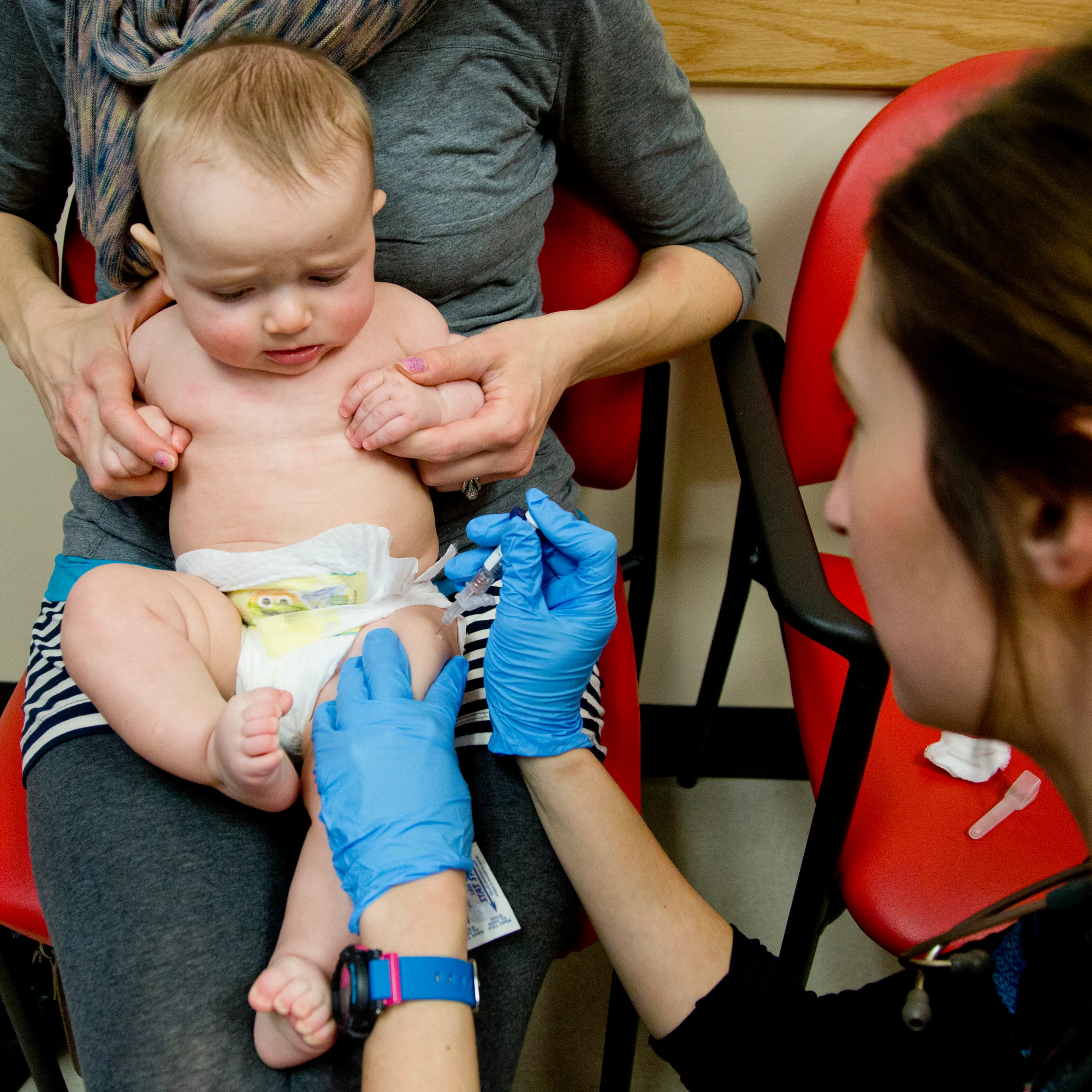 Sad baby, but smart mom: a child is vaccinated against meningitis in Portland, Me.