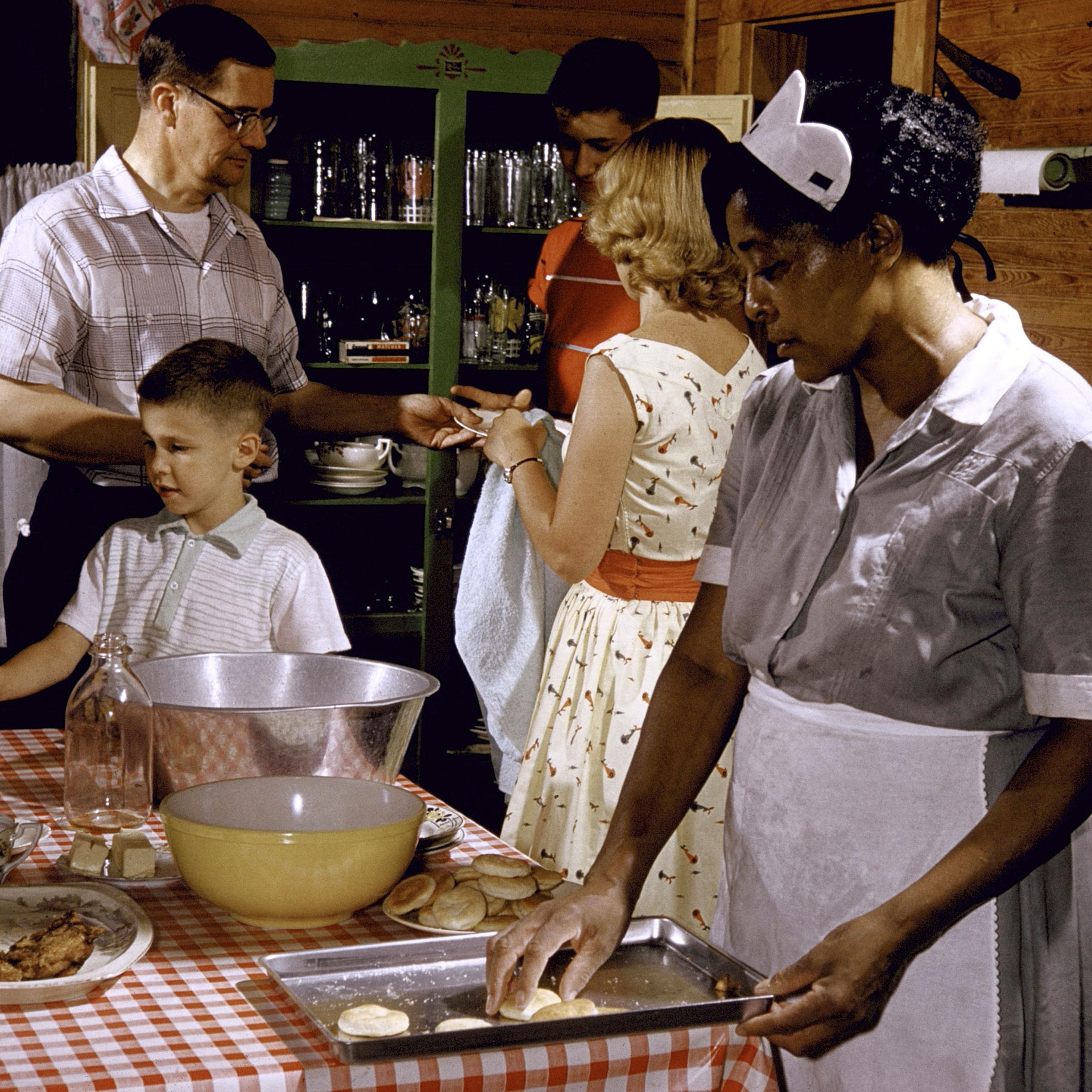 African-American maid prepares a white family's supper in Greenville, SC, 1956.