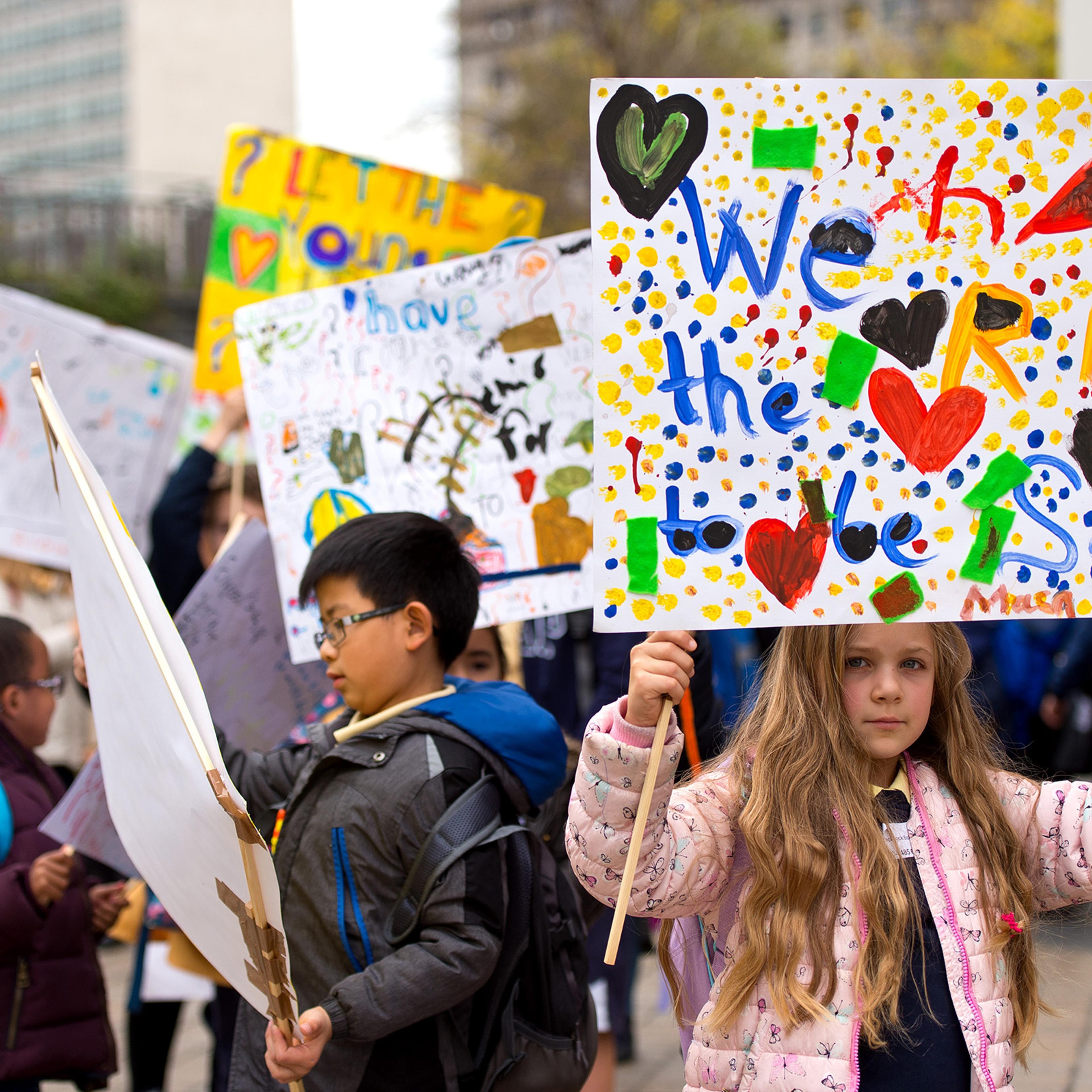 Children march around Southbank Centre in London to celebrate children and young people's rights on Oct. 22, 2015.
