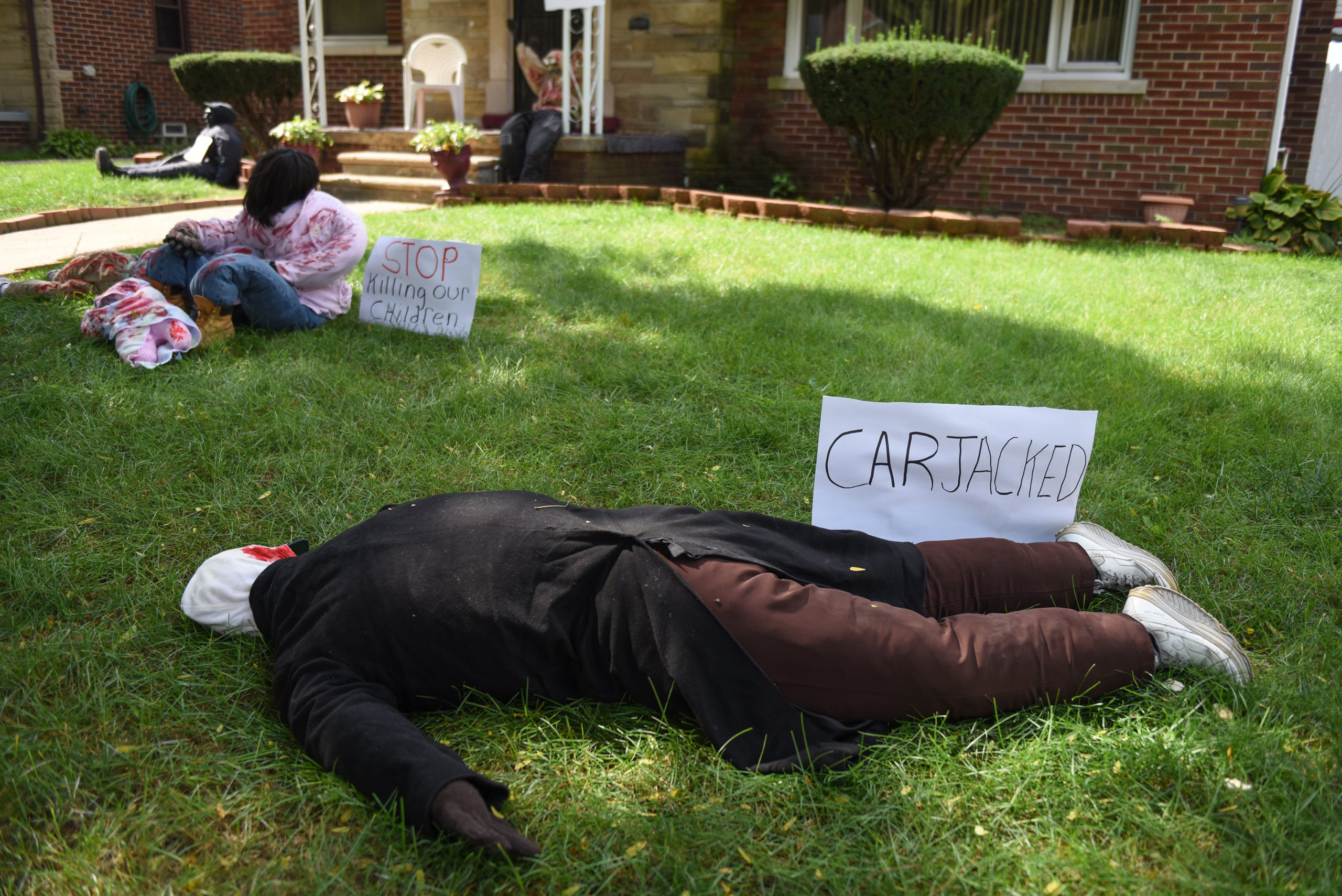 Larethia Haddon imparts a message in her unique halloween display in her front yard of the Bagley neighborhood on Detroit's west side, on Oct. 4, 2016.