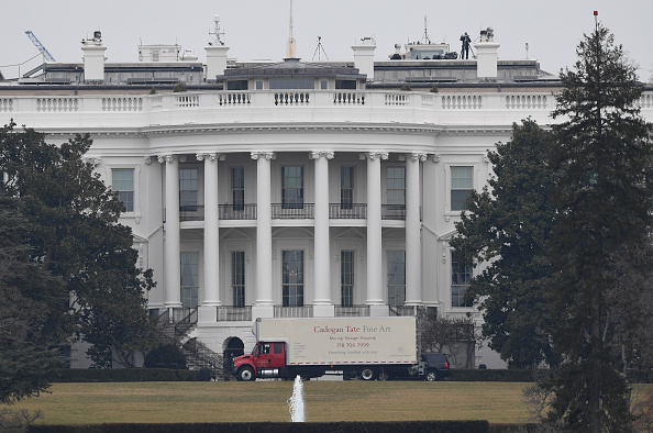 A moving van pulls into the back of the White House in Washington, DC, on January 20, 2017.