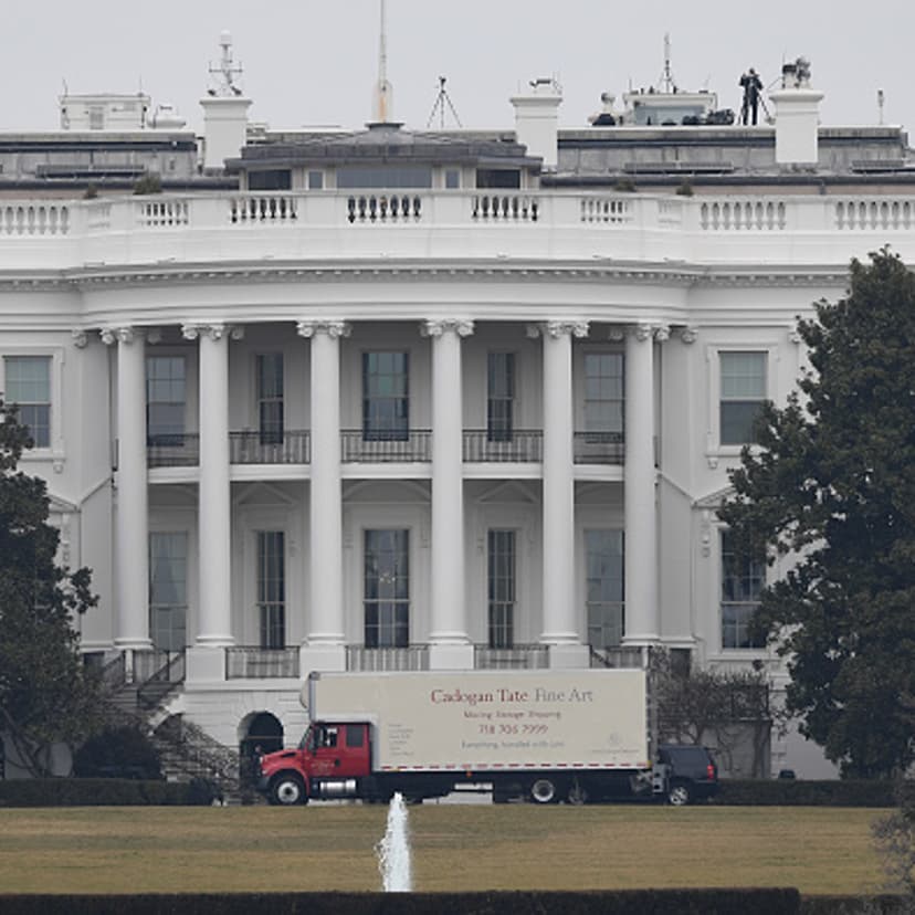 A moving van pulls into the back of the White House in Washington, DC, on January 20, 2017.