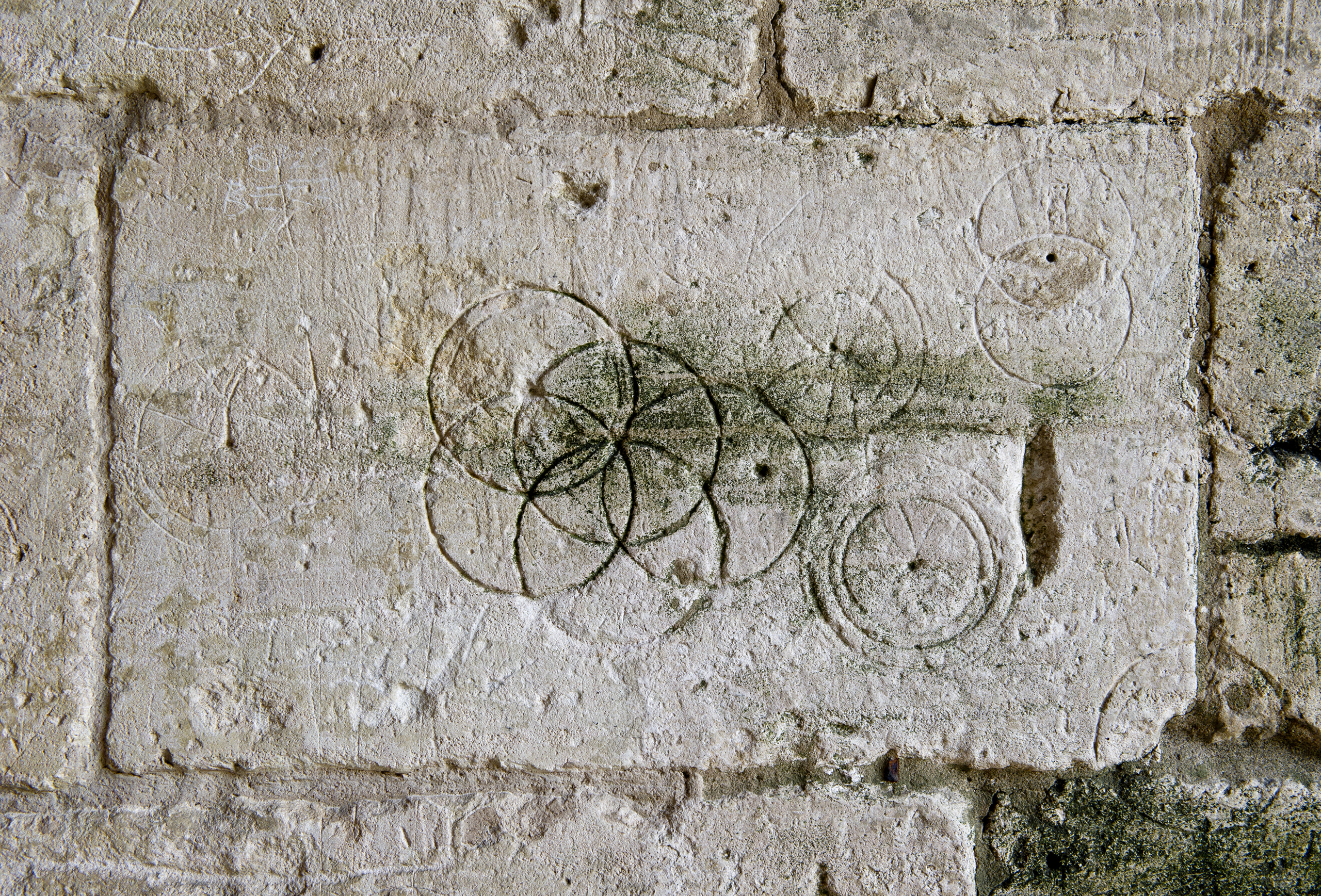 Tithe Barn, Bradford on Avon, Wiltshire. Detail of incised circles in stonework .