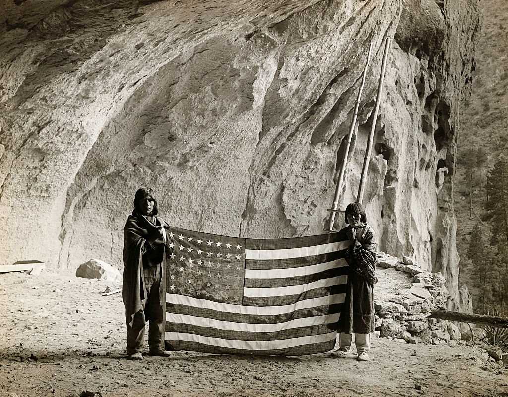 Pueblo Indigenous people at the Ceremonial Cave of the Frijoles Canyon in New Mexico
