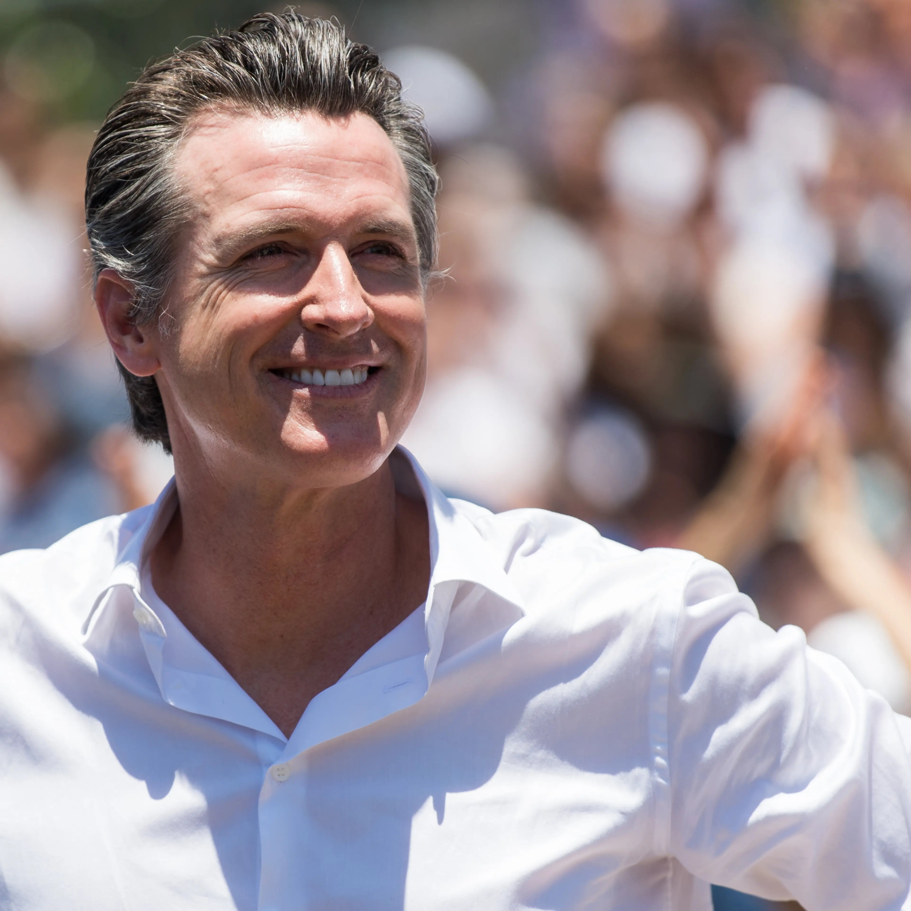 Newsom smiling to the crowd