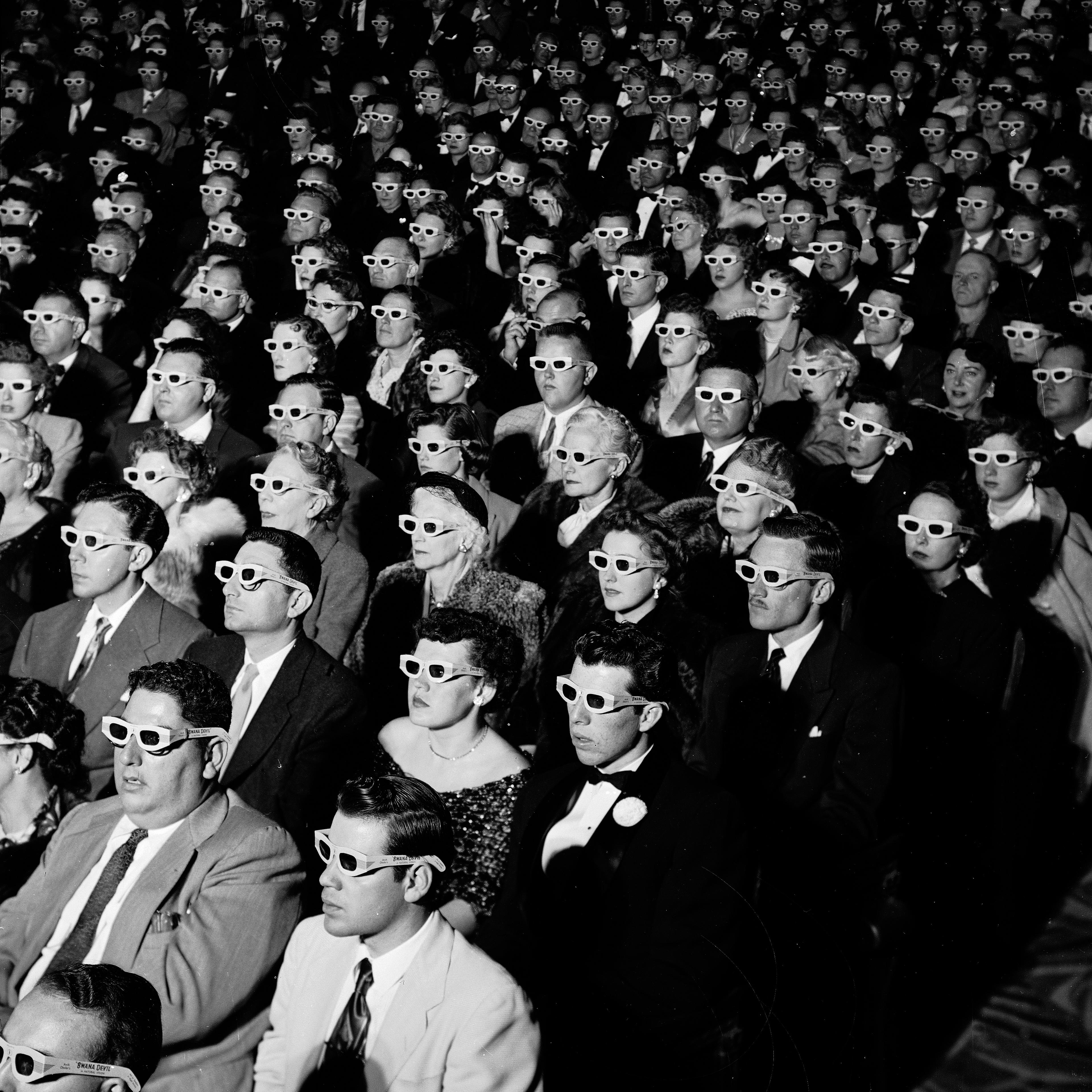 Full frame of movie audience wearing special 3D gl