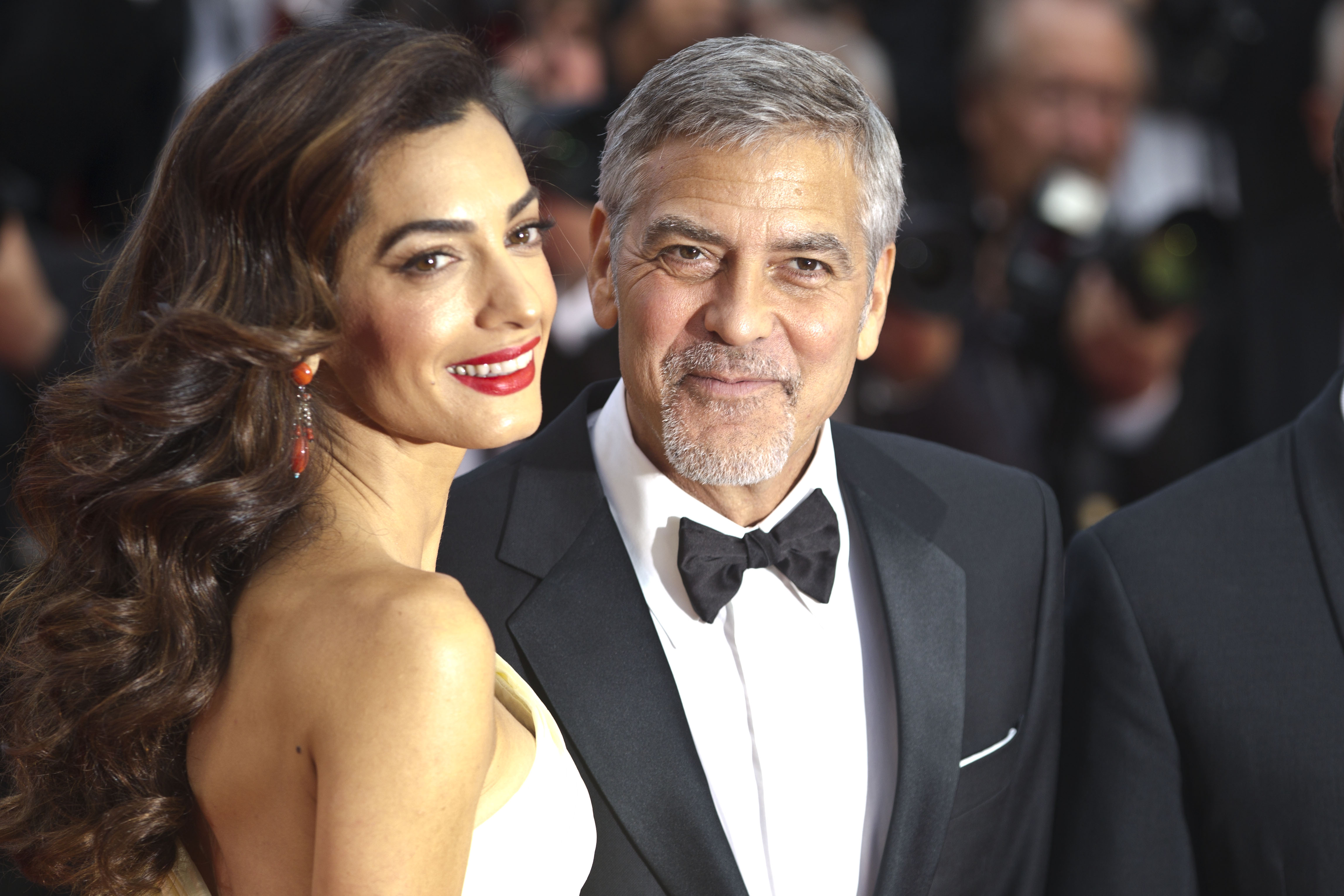 Amal Clooney and George Clooney attend the screening of '