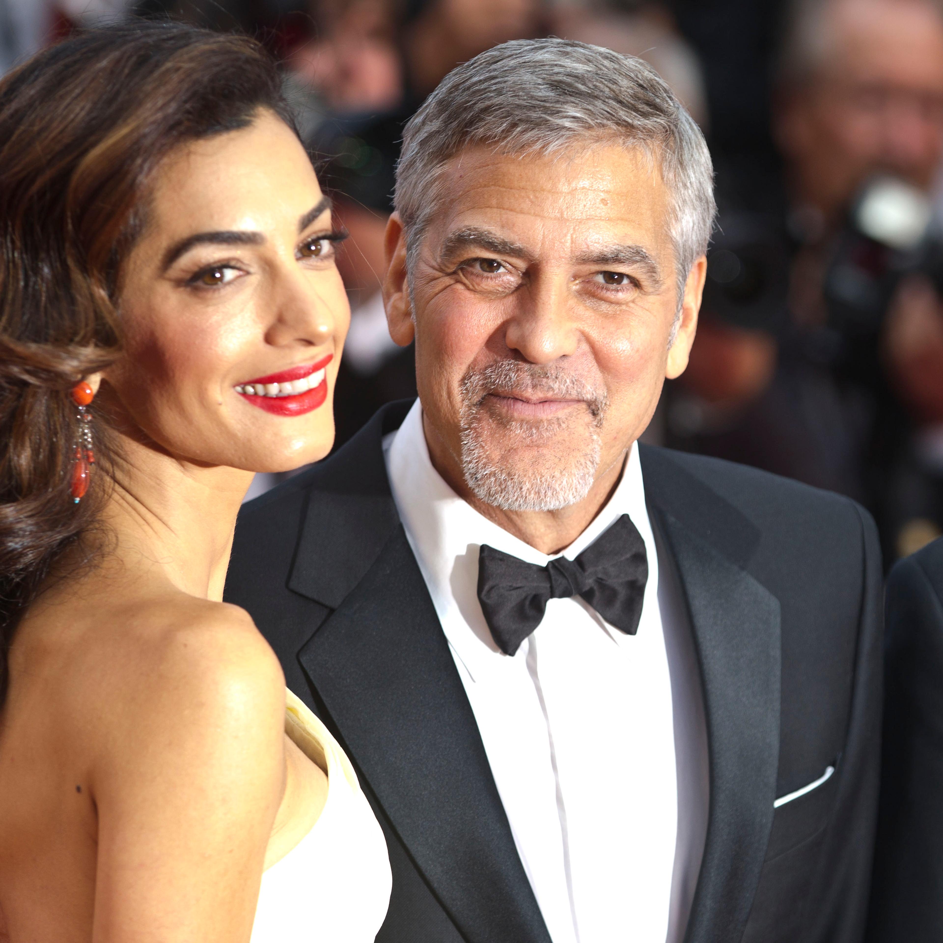 Amal Clooney and George Clooney attend the screening of '